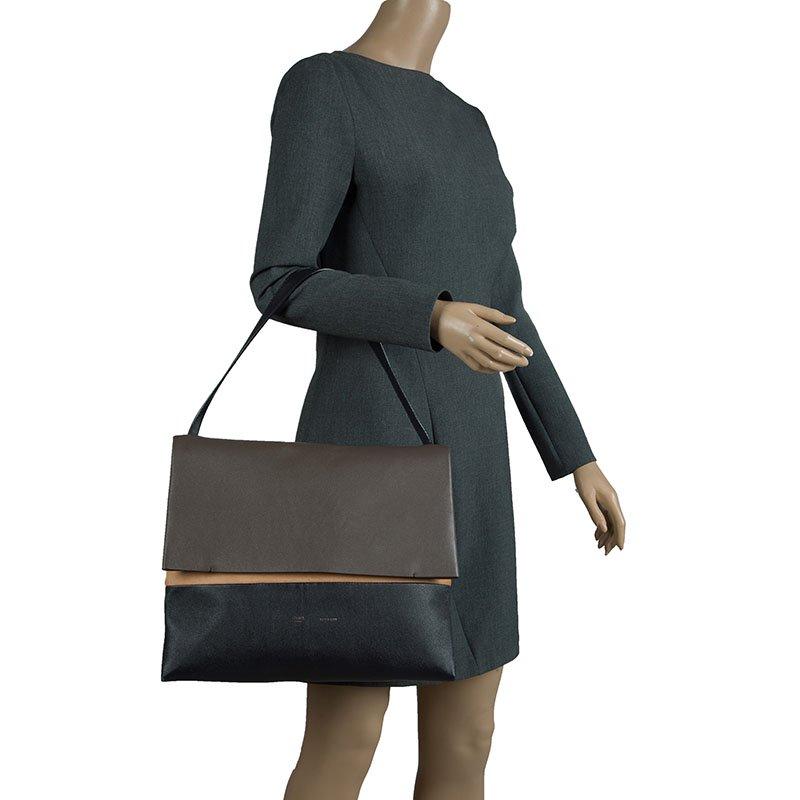 Minimalist Parisian charm for the everyday woman reigns the chic brand, Céline. This Celine All Soft Tote Leather is a neutral and understated look perfect for the modern woman. Crafted from tan, black and grey, this minimalist tote features a