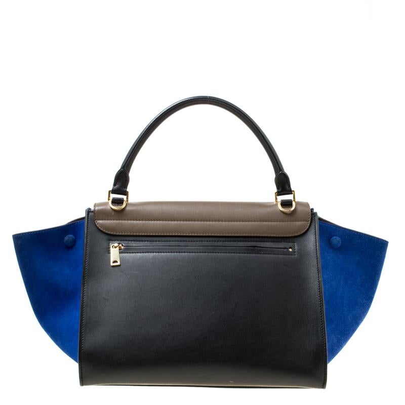 A popular design amongst Celine bags is the Trapeze which is still a common sight in the handbag scene. Here, we have the one in three colours. Crafted from leather and suede in Italy, the bag is designed to catch glances from a mile. It has the