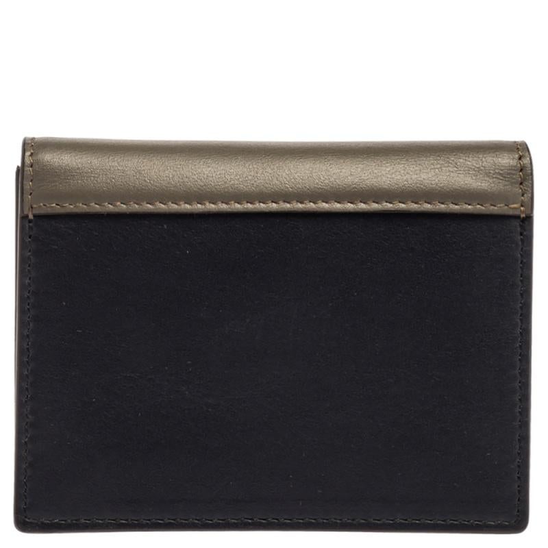 With this classy creation from Celine, your essentials need not be mundane anymore. Carry your cards in style with this pocket cardholder. Crafted from leather in three different shades, it has a snap flap closure and a leather interior. Organizing