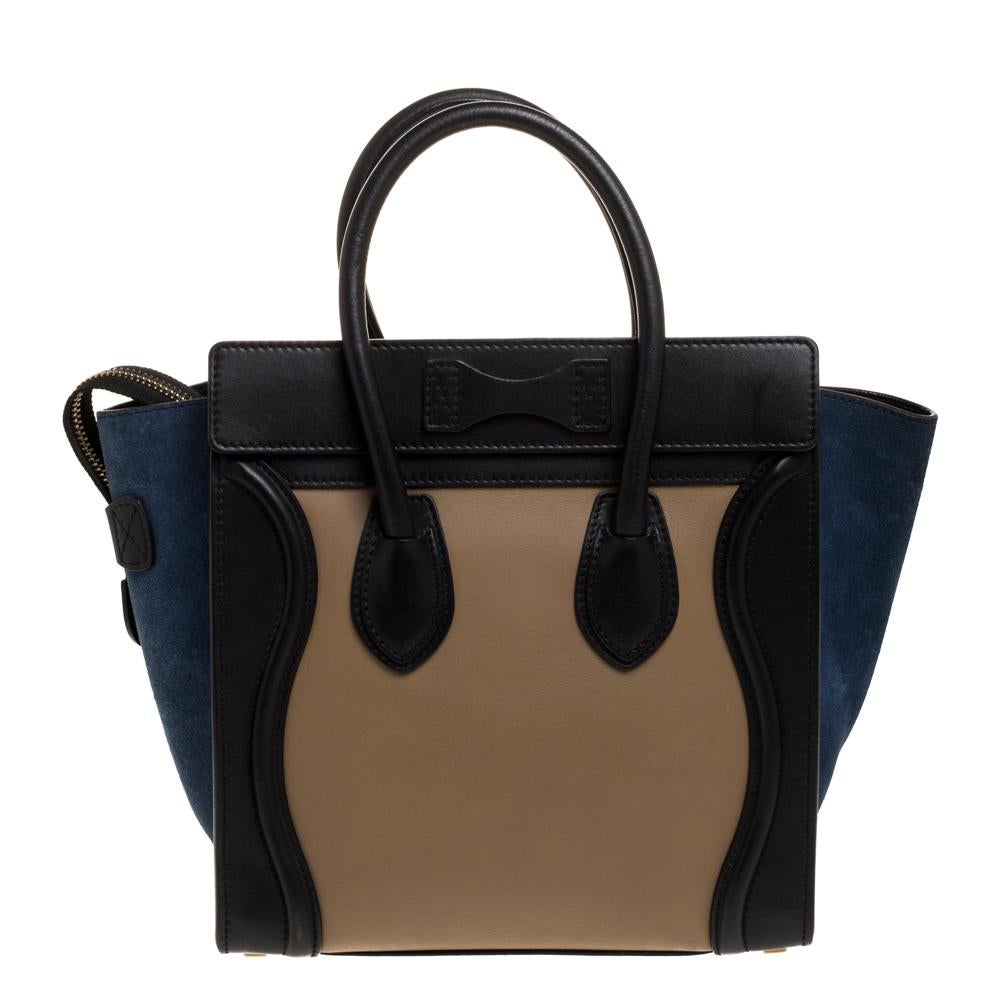 The micro Luggage tote from Celine is one of the most popular handbags in the world. This tote is crafted from leather and suede and designed in lovely shades. It comes with rolled top handles, metal feet at the bottom, and a front zip pocket. The