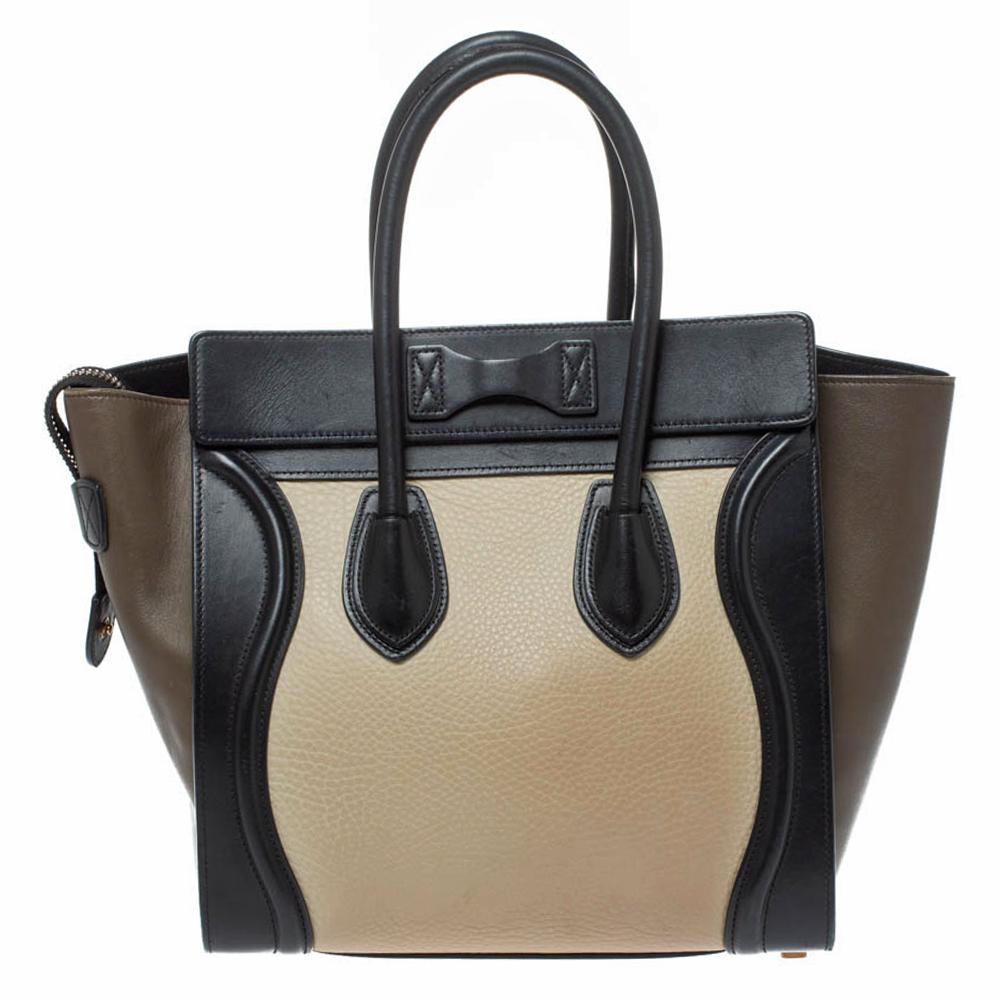 The micro Luggage tote from Celine is one of the most popular handbags in the world. This tote is crafted from leather and designed in a tricolor palette. It comes with rolled top handles and a front zip pocket. The bag is equipped with a well-sized