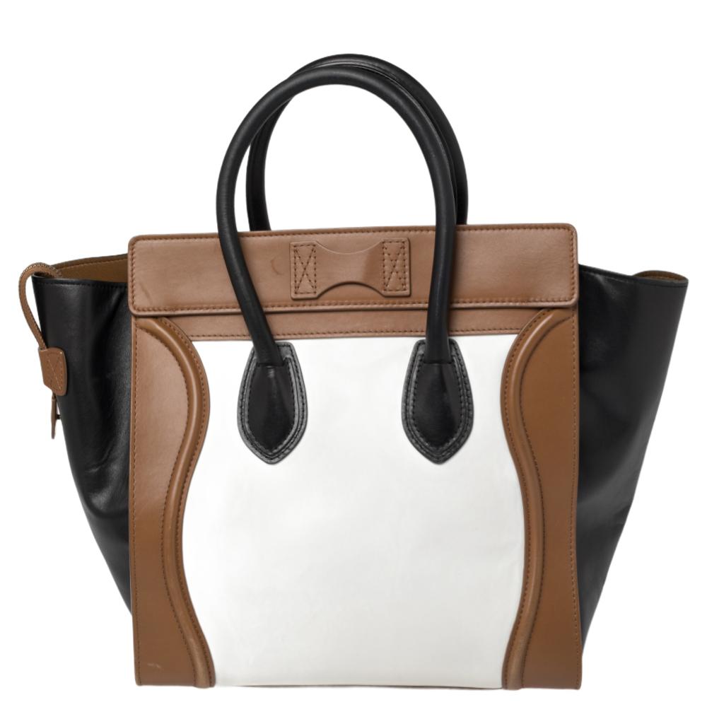 The Luggage tote from Celine is one of the most popular handbags in the world. This tote is crafted from leather and designed in three shades. It comes with rolled top handles and a front zip pocket. The bag is equipped with a well-sized leather