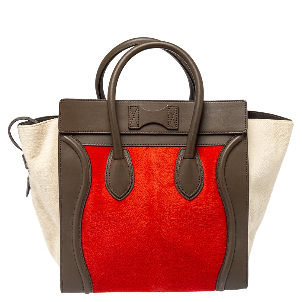 The mini Luggage tote from Celine is one of the most popular handbags in the world. This tote is crafted from pony hair and leather and designed in lovely shades. It comes with rolled top handles and a front zip pocket. The bag is equipped with a