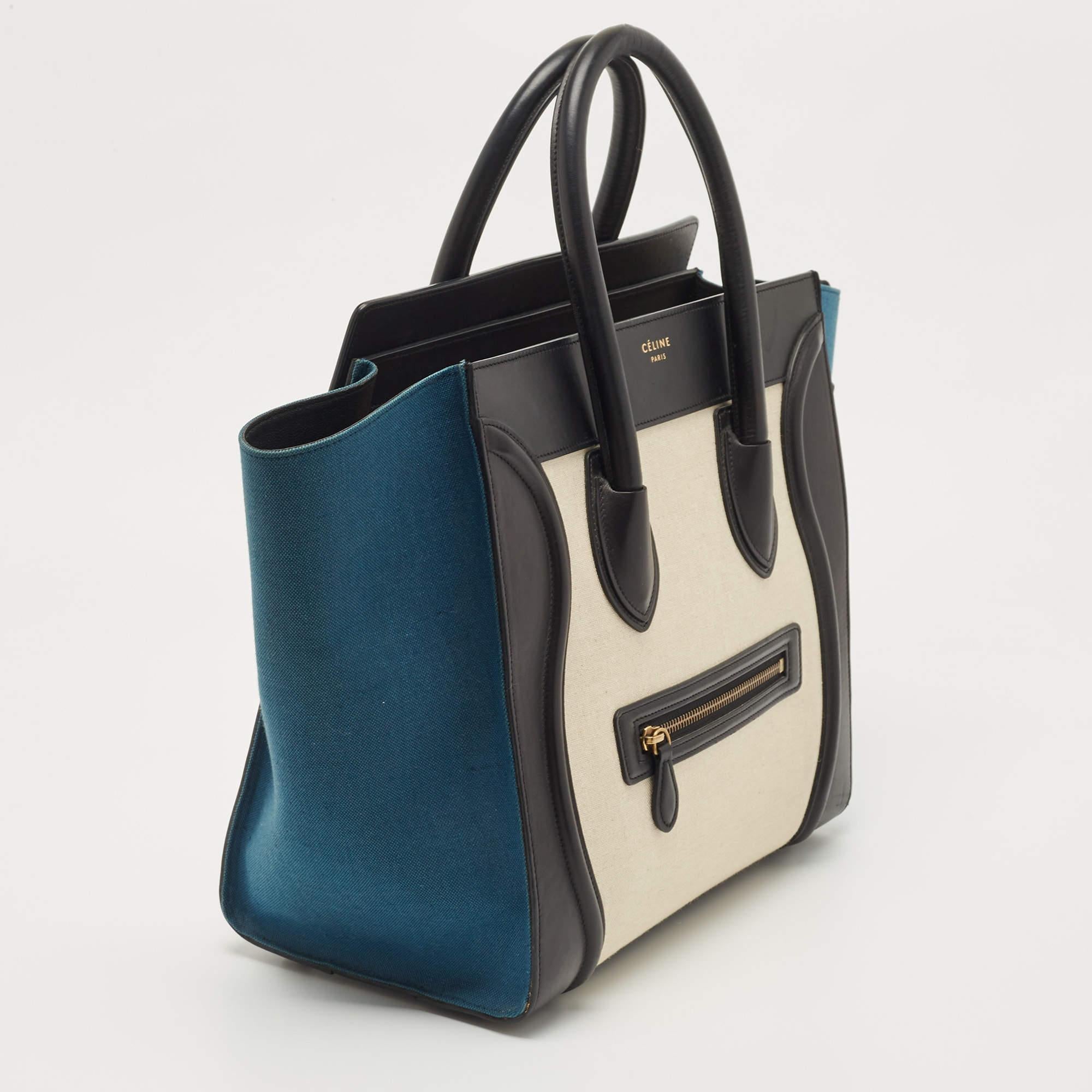 The Céline Luggage tote is a luxurious fashion accessory, featuring a blend of high-quality canvas and leather materials. This compact yet stylish tote showcases a tricolor design, with contrasting panels of canvas and leather, and is adorned with