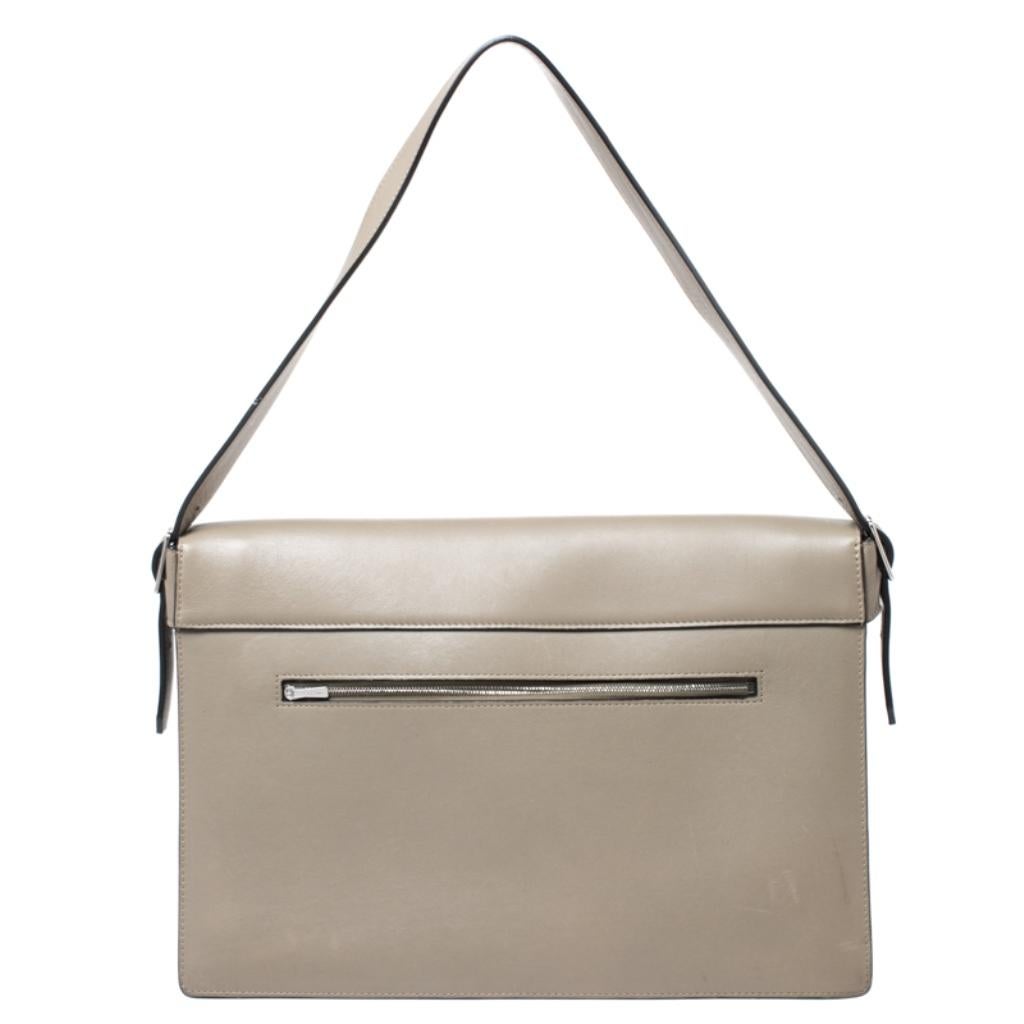 Crafted in tricolor calfhair and leather, this beautiful Diamond shoulder bag from Celine is easy to carry and also perfect with casuals and formals. The envelope front flap opens with a silver-tone lock closure to a leather-lined interior with