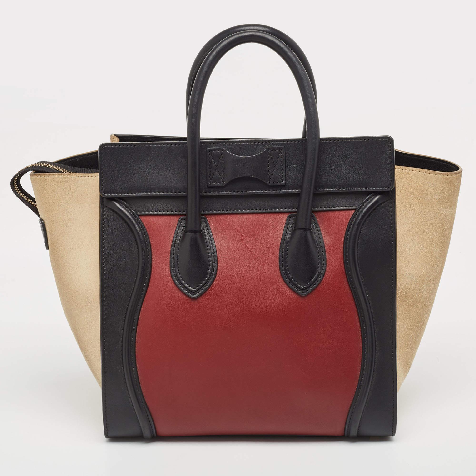 The Celine Luggage Tote exudes elegance with its harmonious blend of textures. Crafted with meticulous attention to detail, it features luxurious leather and sumptuous suede in a tasteful tricolor design. Its compact size belies its ample capacity,