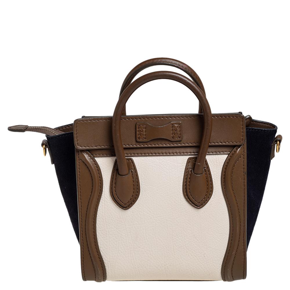 The Nano Luggage tote from Celine is one of the most popular handbags in the fashion world. This tote is crafted from leather and suede in a tricolor hue. It comes with rolled top handles, a detachable shoulder strap and a front zip pocket. The bag