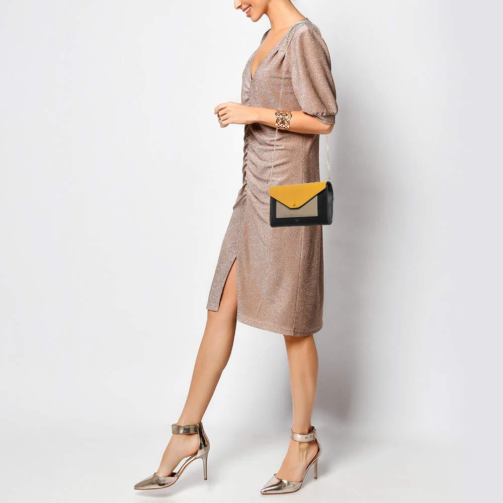 The Celine Wallet on Chain stands out with its bold tricolor design effortlessly blending function and style. Its envelope structure is sleek yet practical offering a streamlined profile with just the right amount of edge.