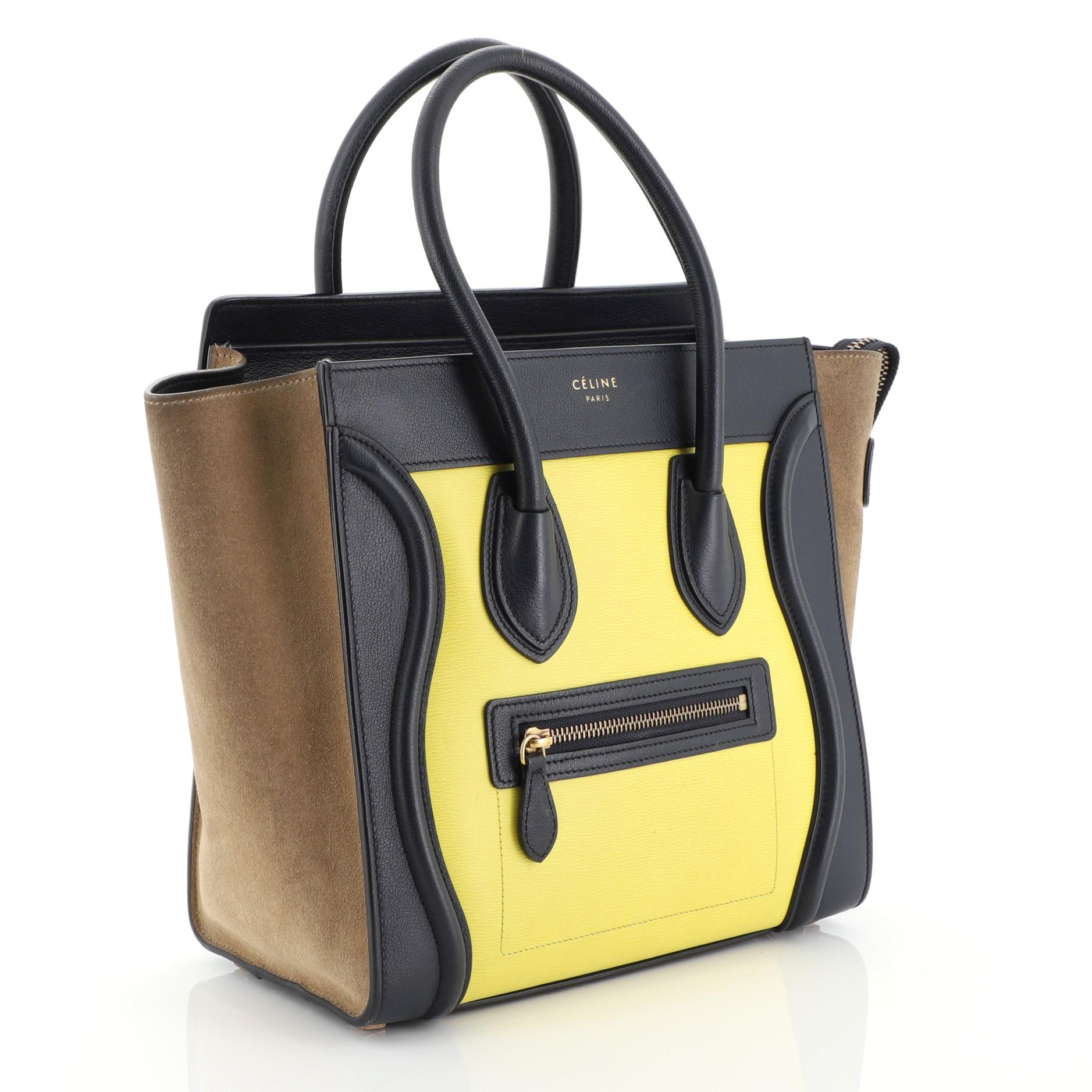This Celine Tricolor Luggage Handbag Leather Micro, crafted in blue, yellow and brown leather, features dual rolled leather handles, front zip pocket, and aged gold-tone hardware. Its zip closure opens to a blue leather interior with zip and slip