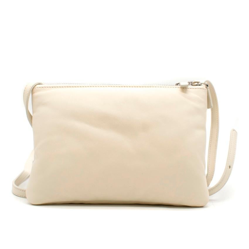 Celine Ivory Trio Zip Smooth Lambskin Crossbody Bag 

- Soft touch
- 100% Lambskin
- Gold toned metal hardware
- 100% Textile lining
- Zip closure 
- Three zipped pouches attached together with snap buttons 
- Adjustable leather wrap  
- Can be