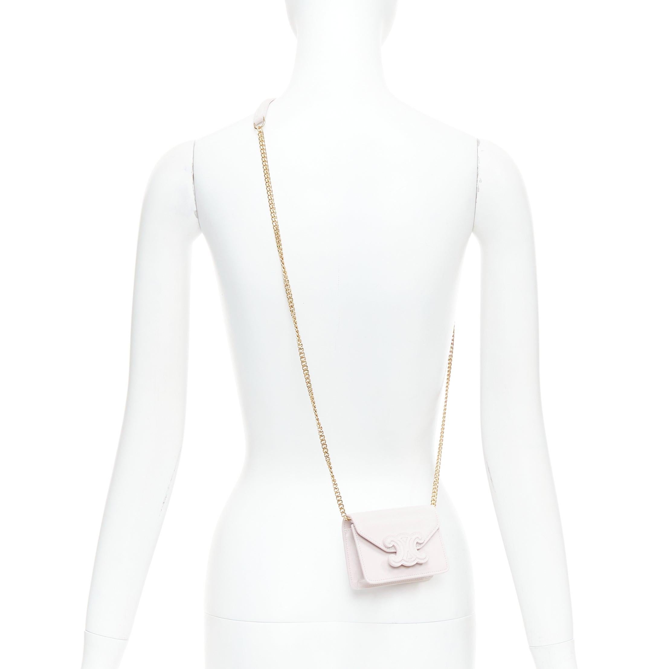 CELINE Triomphe lilac leather logo cardholder on chain crossbody bag
Reference: NKLL/A00365
Brand: Celine
Designer: Hedi Slimane
Model: Triomphe
Material: Leather
Color: Purple, Gold
Pattern: Solid
Closure: Snap Buttons
Lining: Purple Leather
Extra