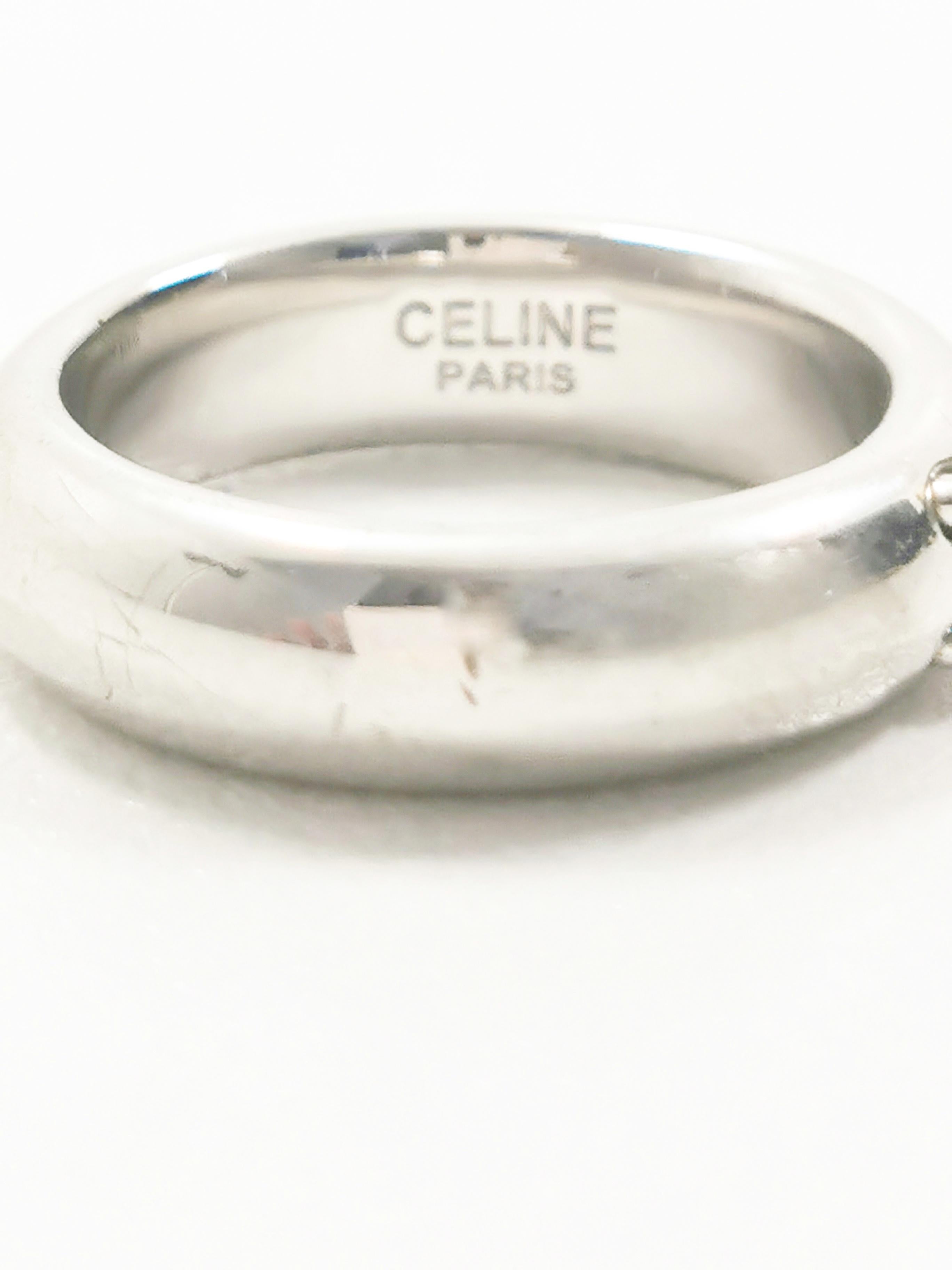 Immerse yourself in the understated elegance of the Celine Triomphe Silver Ring, a piece that effortlessly encapsulates the timeless sophistication synonymous with the Celine brand. This ring is a testament to the brand's commitment to minimalism,
