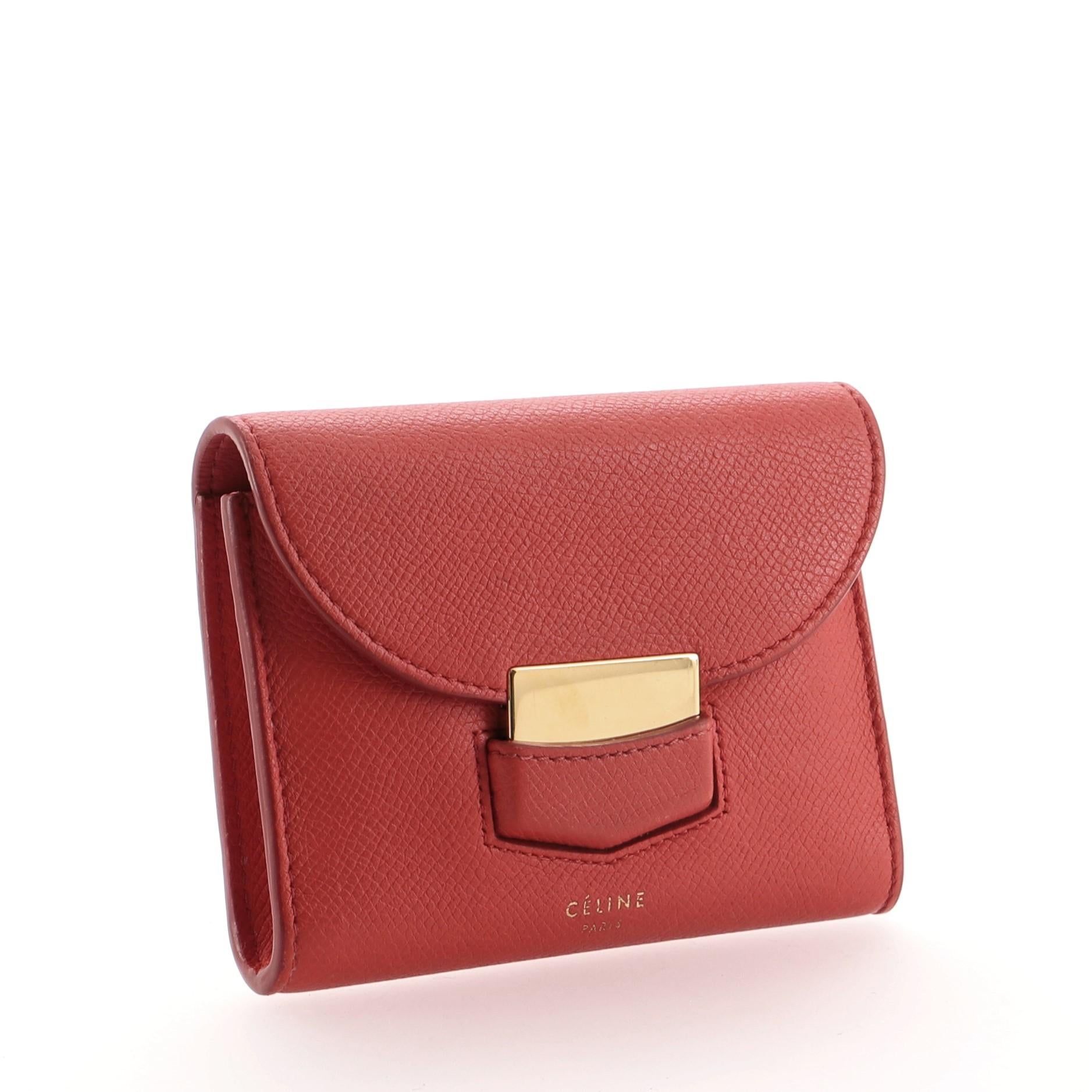 Celine Trotteur Flap Wallet Leather Small
Red

Condition Details: Minor wear, darkening and small marks on exterior and in interior, splitting on opening flap corner wax edges. Light cracking on side opening wax edges, creasing and scuffs underneath