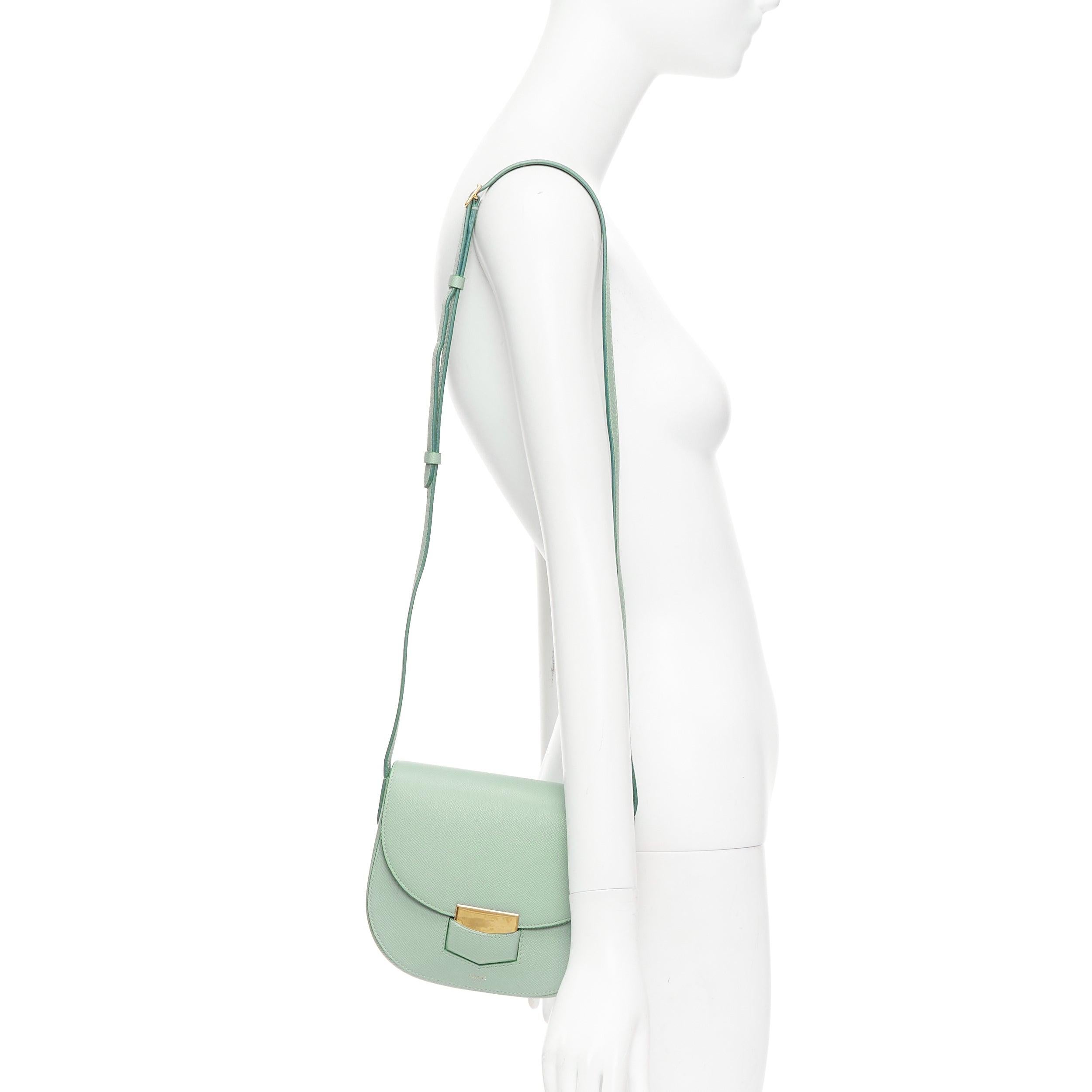 CELINE Trotteur mint green grained leather gold hardware small crossbody bag
Reference: KYCG/A00157
Brand: Celine
Model: Small Trotteur
Material: Leather
Color: Green, Gold
Pattern: Solid
Closure: Loop Through
Lining: Green Leather
Extra Details: