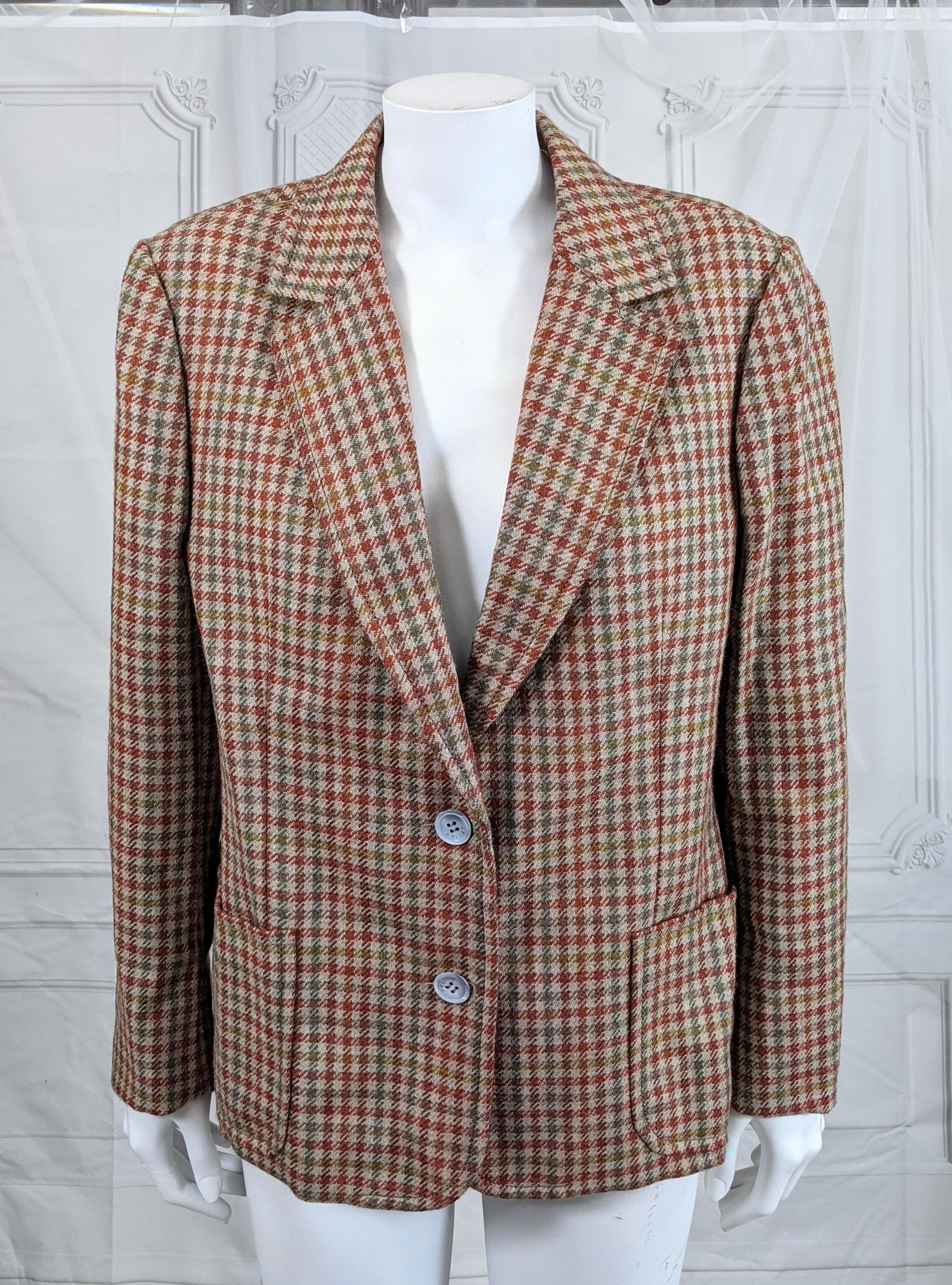 Vintage Celine Tweed Houndstooth Blazer in soft wool in autumnal tones from the 1970's. Straight boxy cut with classic tailoring associated with the French house.
Size 44 vintage (Contemporary is smaller).  Mother of Pearl Logo Celine buttons.