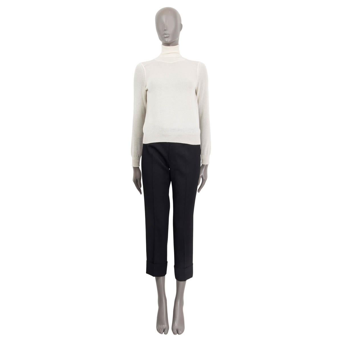 100% authentic Celine see through knit sweater in vanilla cashmere (100%). Comes with a ribbed turtleneck, ribbed cuffs and a ribbed hemline. Unlined. Has been worn and is in excellent condition.

Measurements
Tag Size	XS
Size	XS
Shoulder Width	34cm