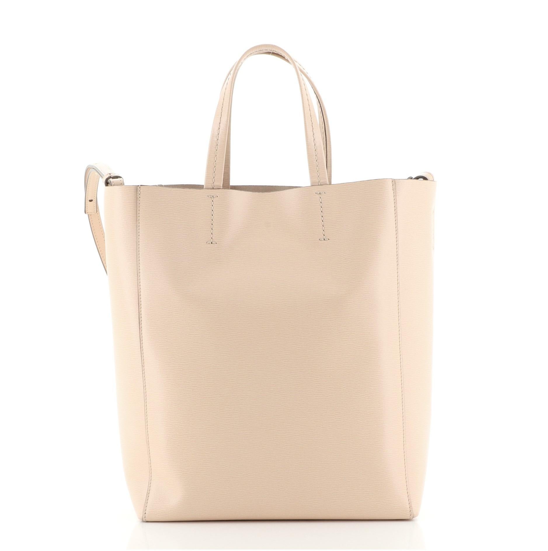Celine Vertical Cabas Tote Grained Calfskin Small
Neutral

Condition Details: Wear on base corners and in interior, small mark on front. Cracking on side opening trim wax edges, scratches on hardware.

50141MSC

Height 11