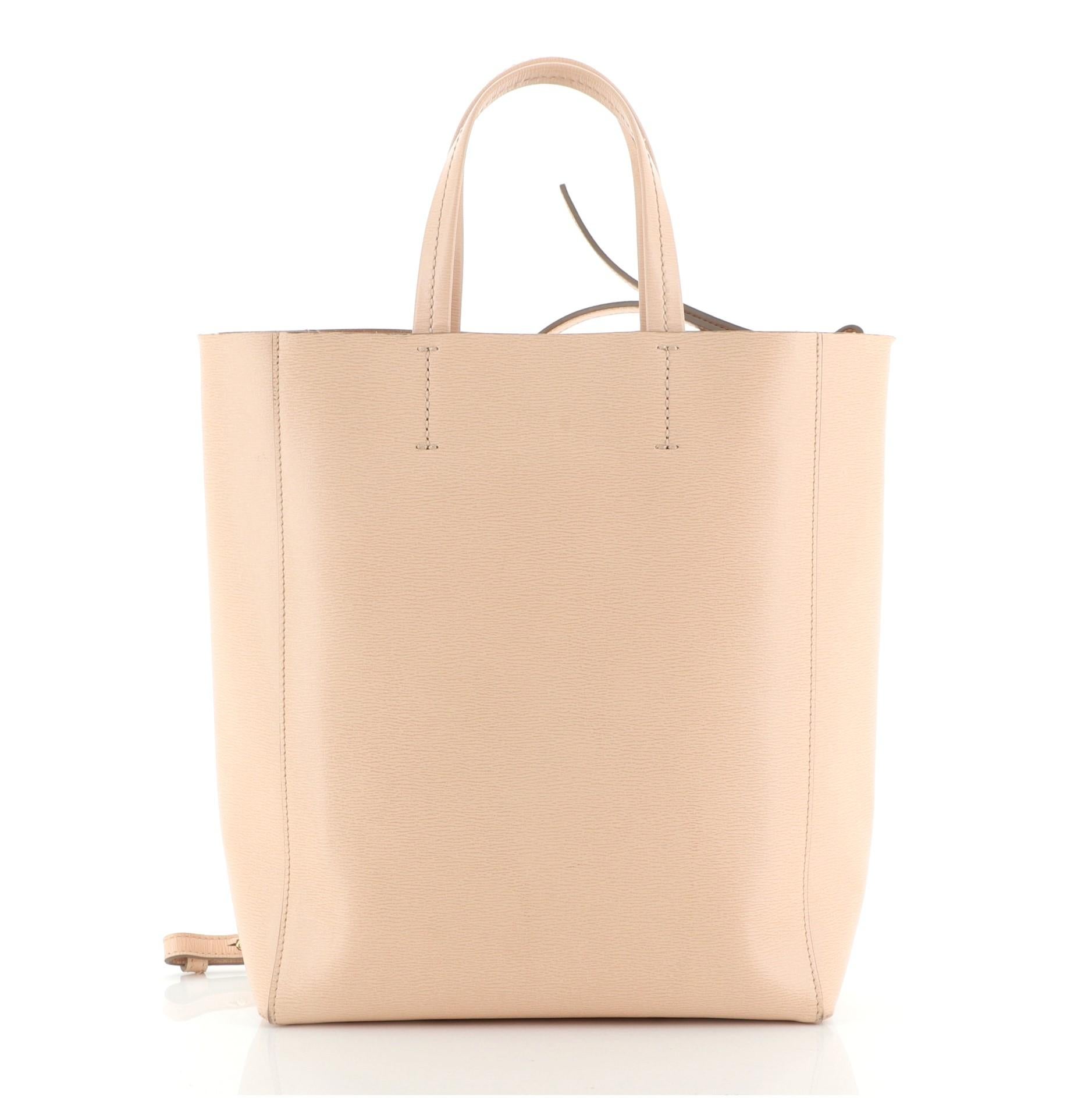 Celine Vertical Cabas Tote Grained Calfskin Small
Pink

Condition Details: Wear and slight darkening on base corners, strap and handles, scuffs in interior, scratches on hardware.

50140MSC

Height 11