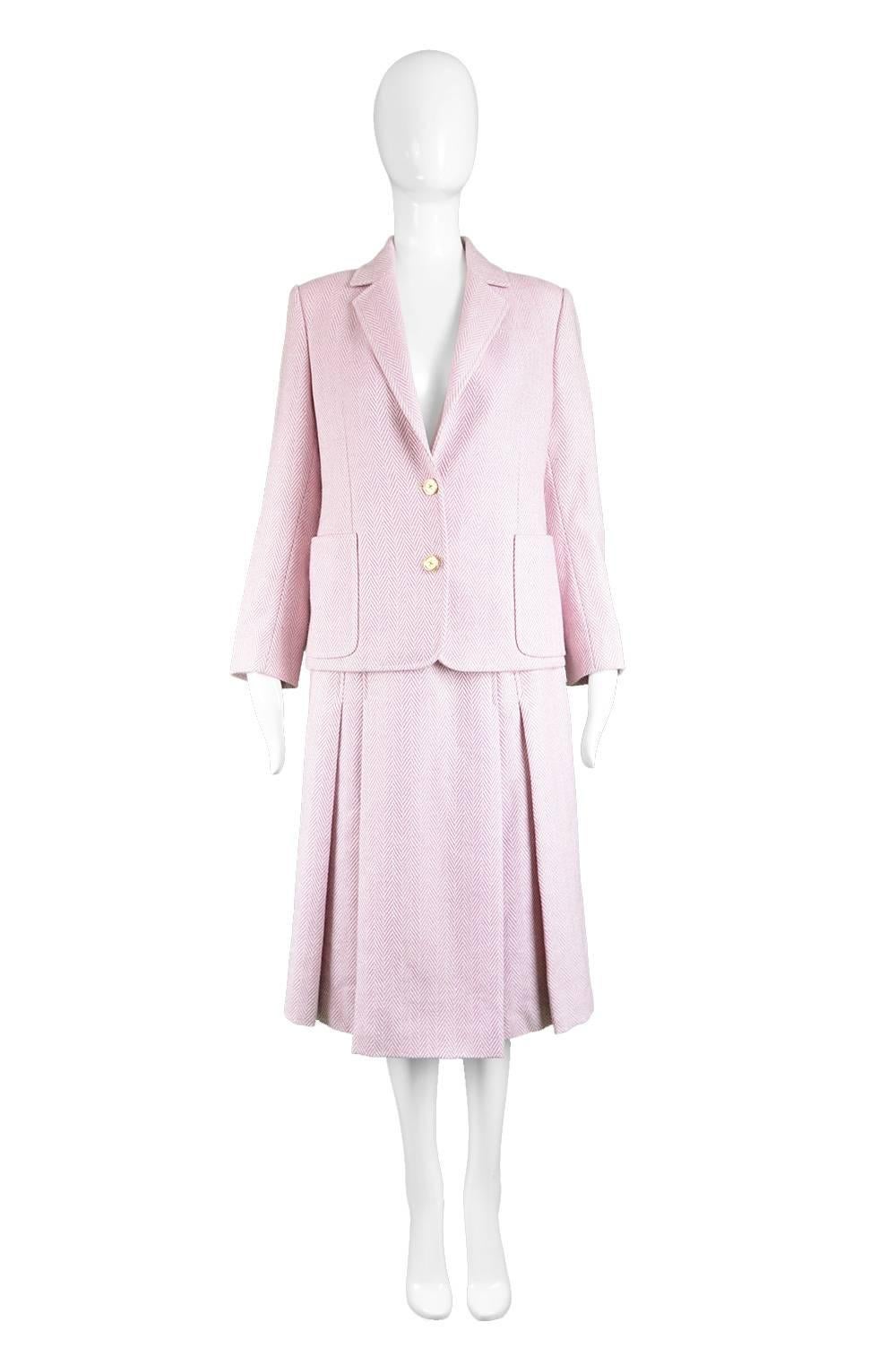 Celine Vintage 1980s Pink Silk & Wool Herringbone Tweed Pleated Mid Length Skirt Suit

Estimated Size: UK 8-10/ US 4-6/ EU 36-38. Please check measurements.  
Jacket
Bust - 38” / 96cm (meant to have a slightly boxy, oversized fit)
Waist - 36” /