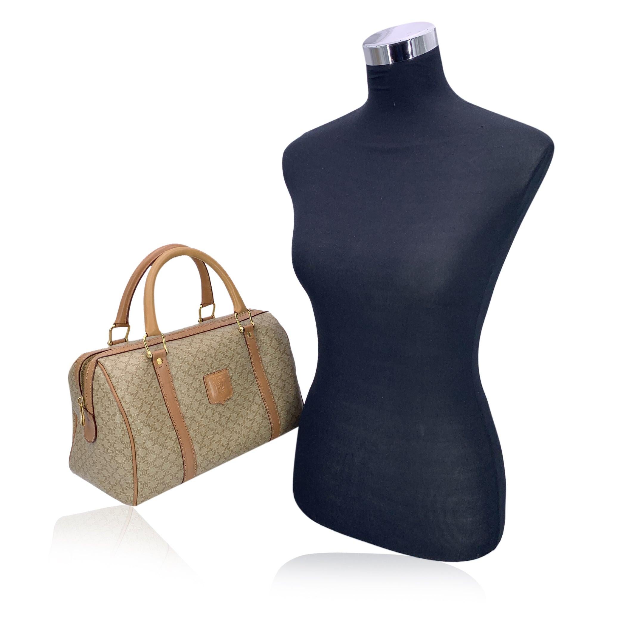 There's something timeless about a piece that carries both history and elegance-and this Celine 'Macadam' Canvas Duffel Bag embodies just that. Crafted in a warm beige canvas patterned with the signature Macadam motif, this Boston-style bag is a