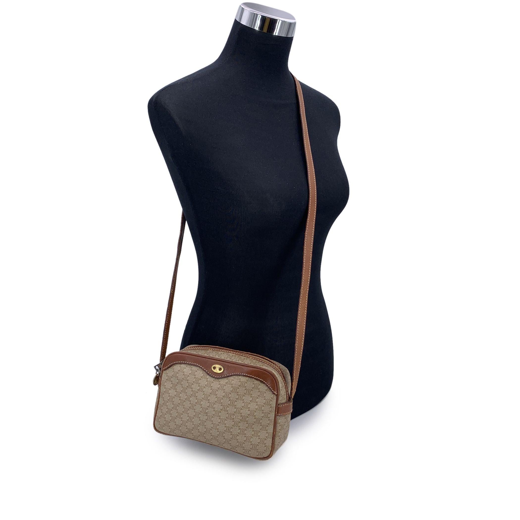 Embrace classic elegance with this beautiful vintage Celine small Macadam crossbody bag-a timeless piece that captures the charm of 1990s-era luxury. Expertly crafted from Celine's signature beige Macadam vinyl canvas and accented with light brown