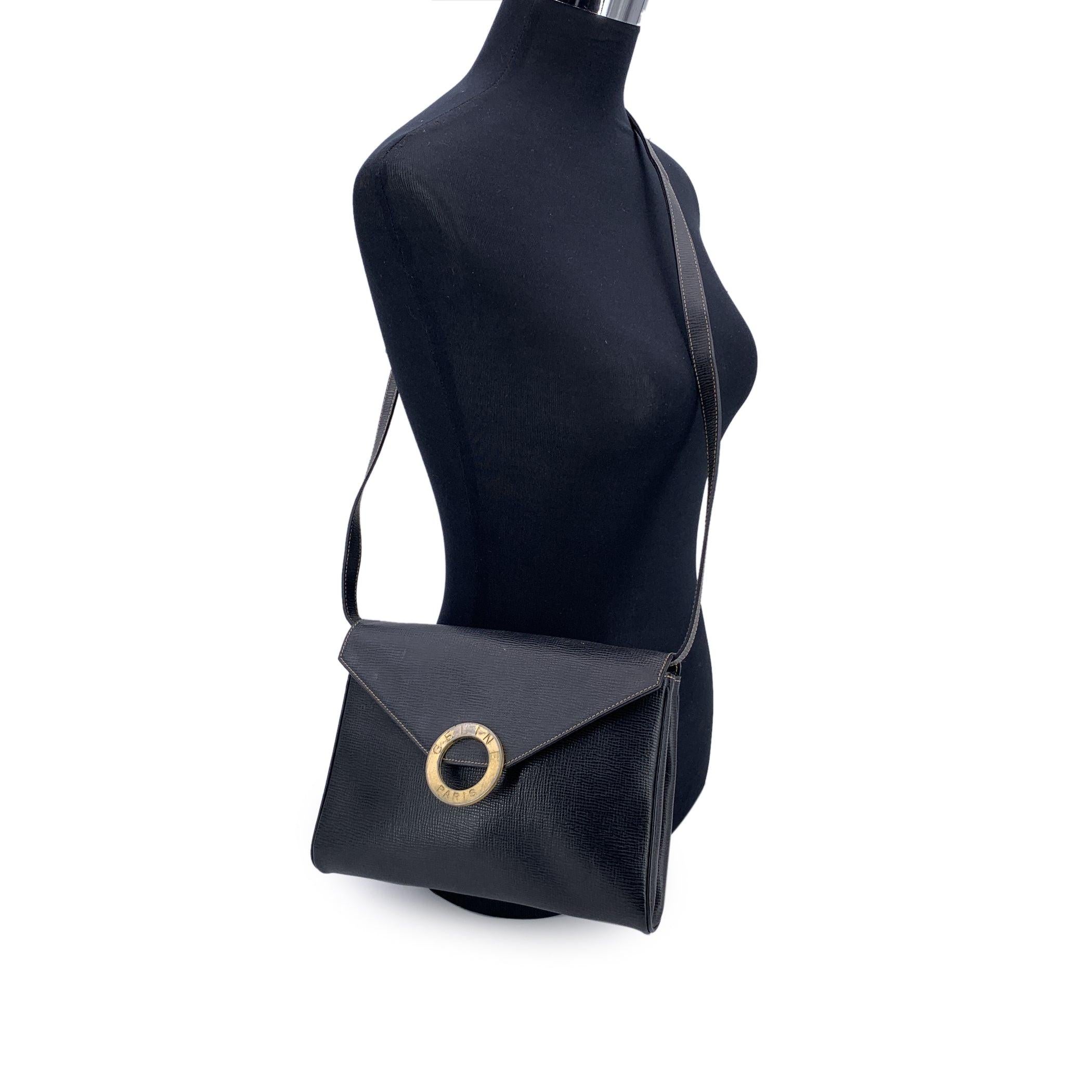 Step into the quiet allure of French sophistication with this Celine black leather Ring convertible shoulder bag - a piece that whispers luxury with every detail. Crafted in supple black leather, its silhouette is gracefully understated, allowing