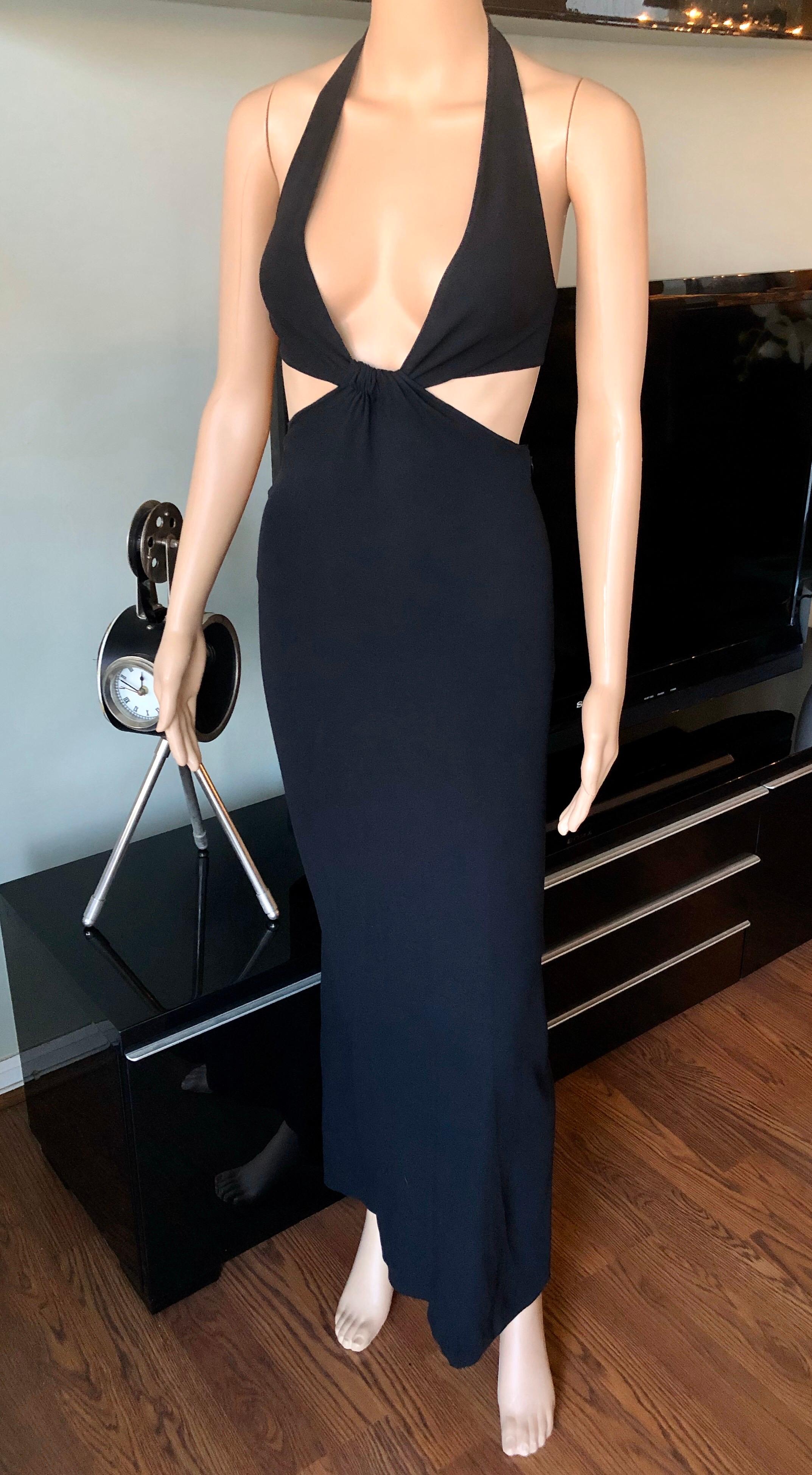 Celine Vintage Cutout Black Maxi Dress Gown FR 36

Celine maxi dress featuring plunging neckline, cutout accents at waist and concealed zip featuring clasp closure at back. 
