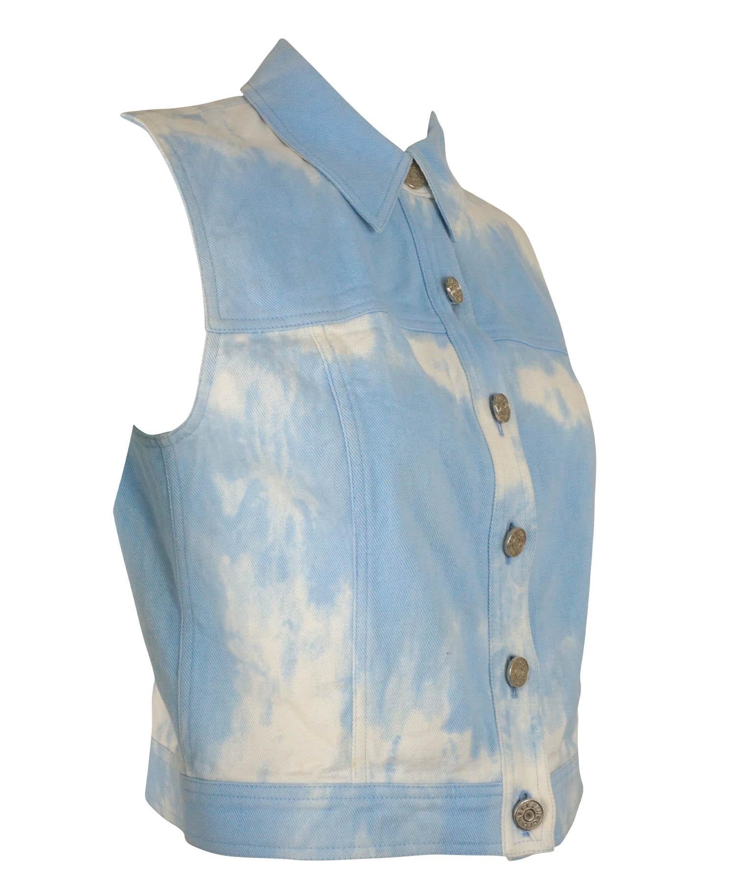 Celine vintage denim vest, dating back to the early 2000's in the Y2K era, is featured in a white and blue washed style resembling clouds. Vest has six buttons at the front and a folded collar. Designer size 38. Made in France. 

