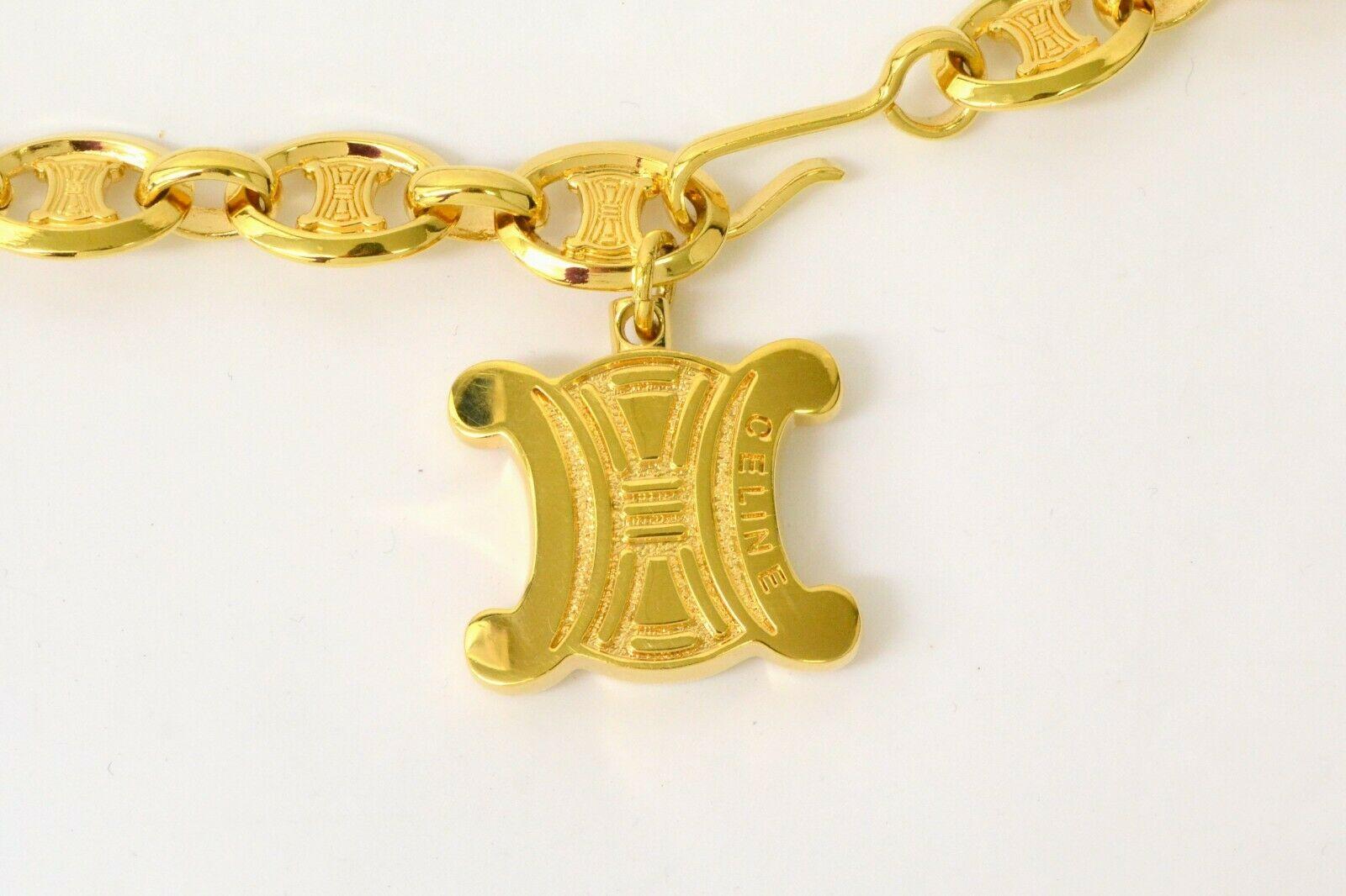 Celine Vintage Gold Logo Chain Link Charm Waist Belt 

Metal
Gold tone
Hook closure
Width 0.5