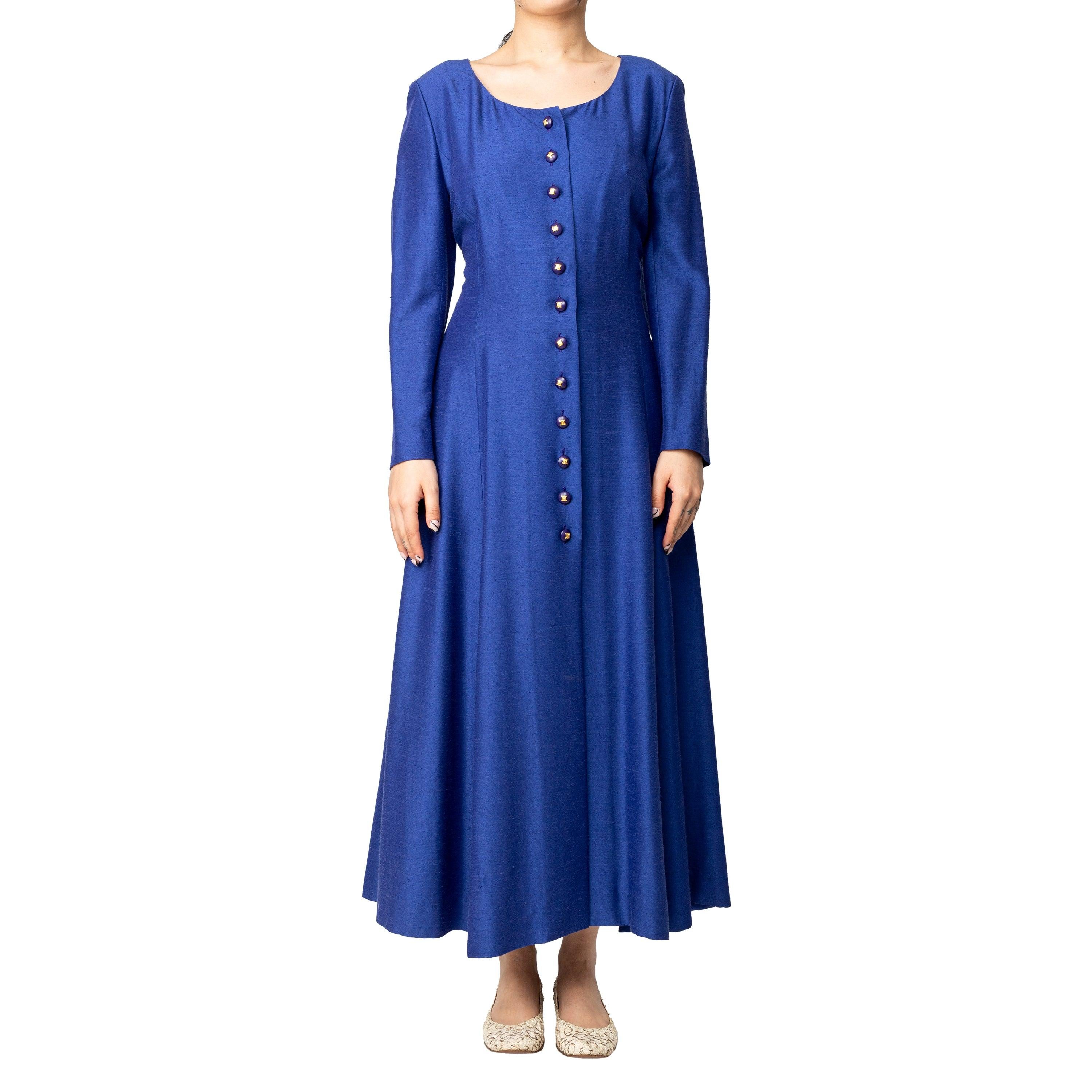 Expertly crafted by Celine, this vintage dress exudes sophistication and style. The pleats at the hem add a unique and fun silhouette with the slits in between, while the deep round neck and long sleeves add to the elegance of the dress. Complete