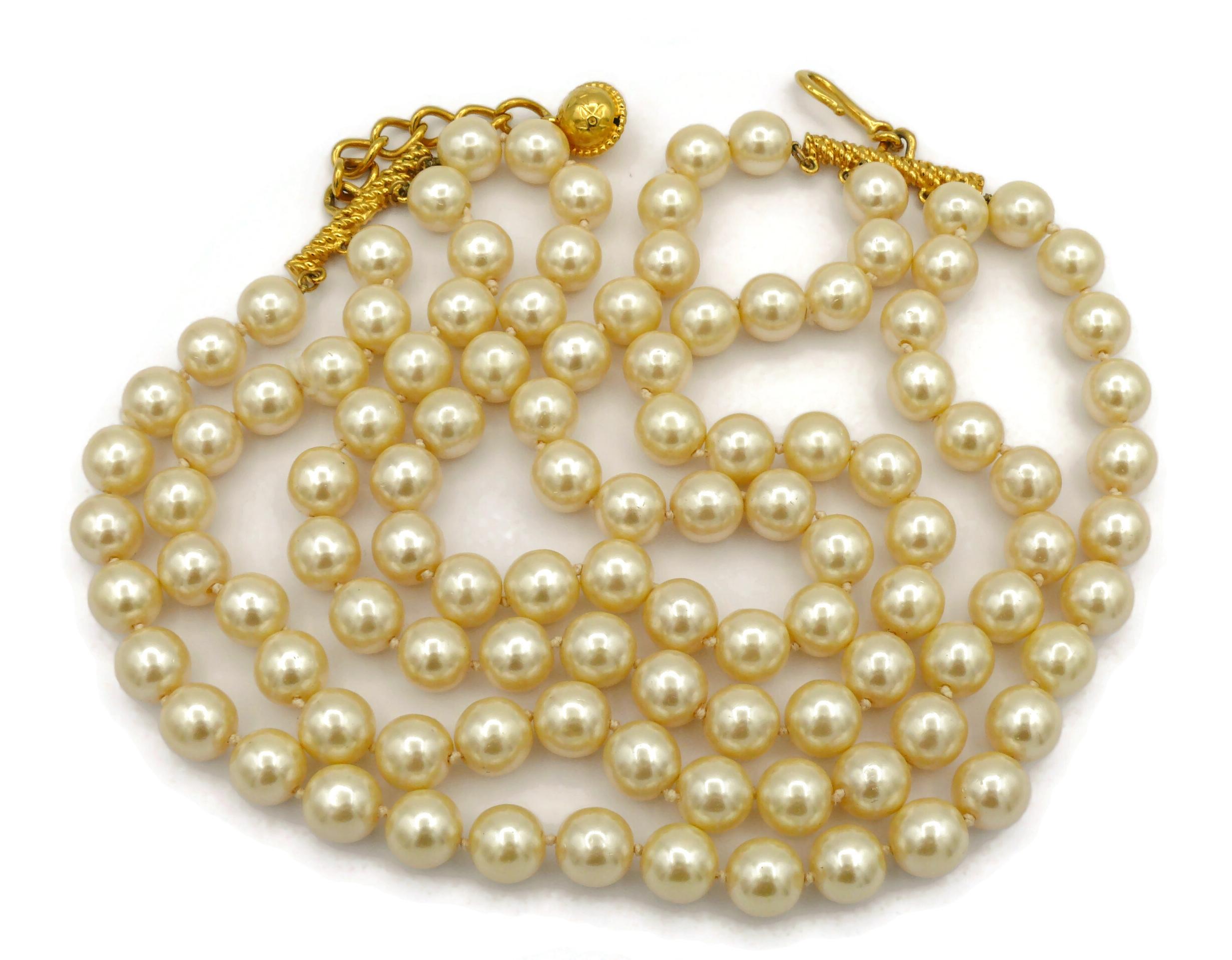 CELINE vintage glass pearl four strands necklace.

Adjustable hook closure.

Unmarked.
But very recognizable with the iconic CELINE planisphere charm.

Indicative measurements : adjustable length from approx. 47.5 cm (18.70 inches) to approx. 51.5