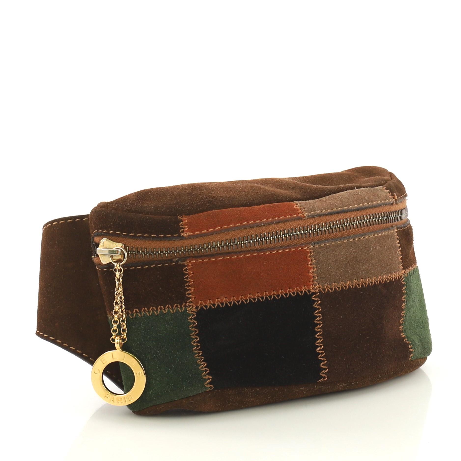 This Celine Vintage Waist Bag Patchwork Suede, crafted in multicolor patchwork suede, features an adjustable strap and gold-tone hardware. Its zip closure opens to a brown leather interior .

Condition: Fair. Odor in interior. Moderate wear,