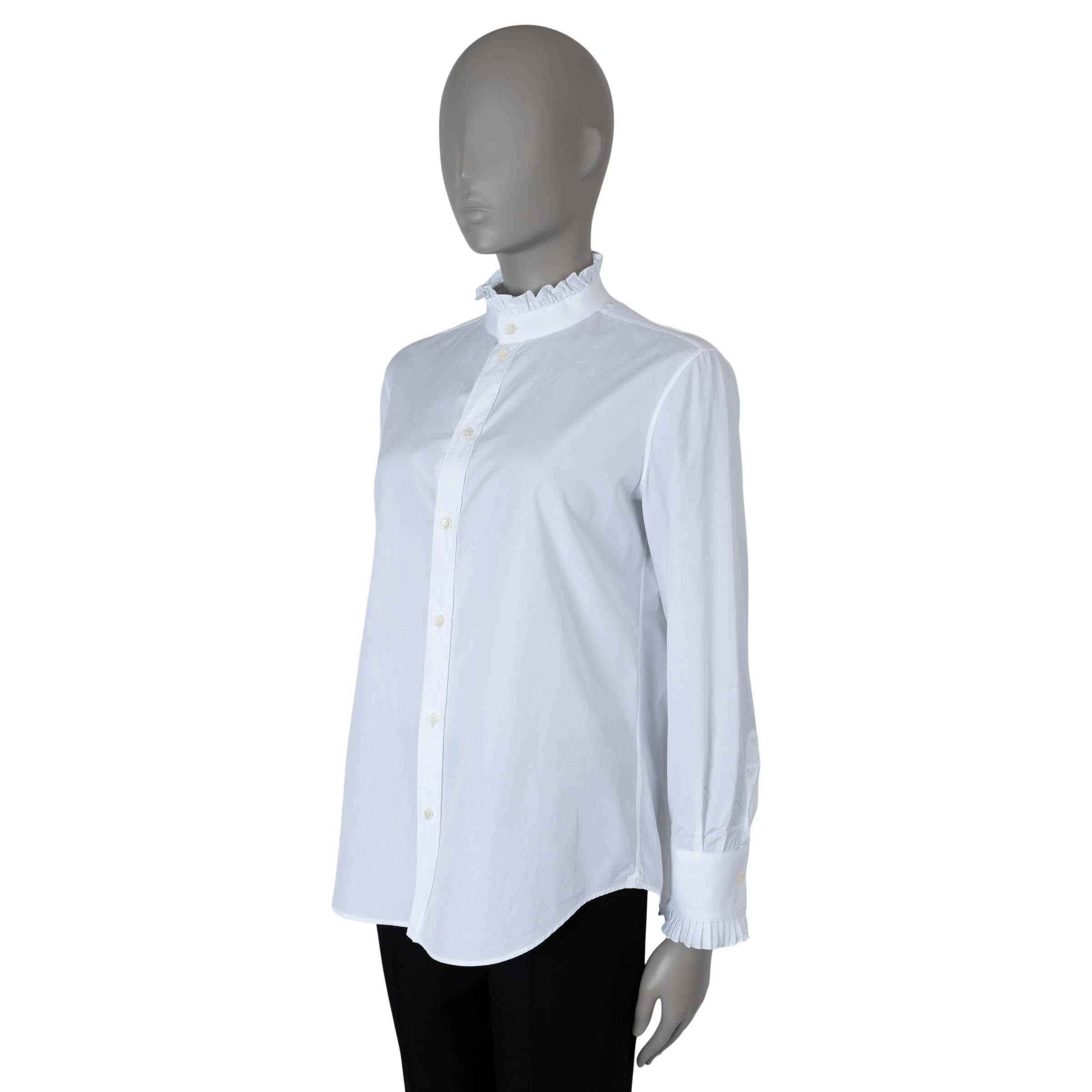 This 100% authentic Celine by Hedi Slimane button-up shirt is crafted from white poplin cotton (100% - please note the content tag is missing). It features a frilled mock-neck with a band collar and pleated cuffs, adding a touch of elegance to the