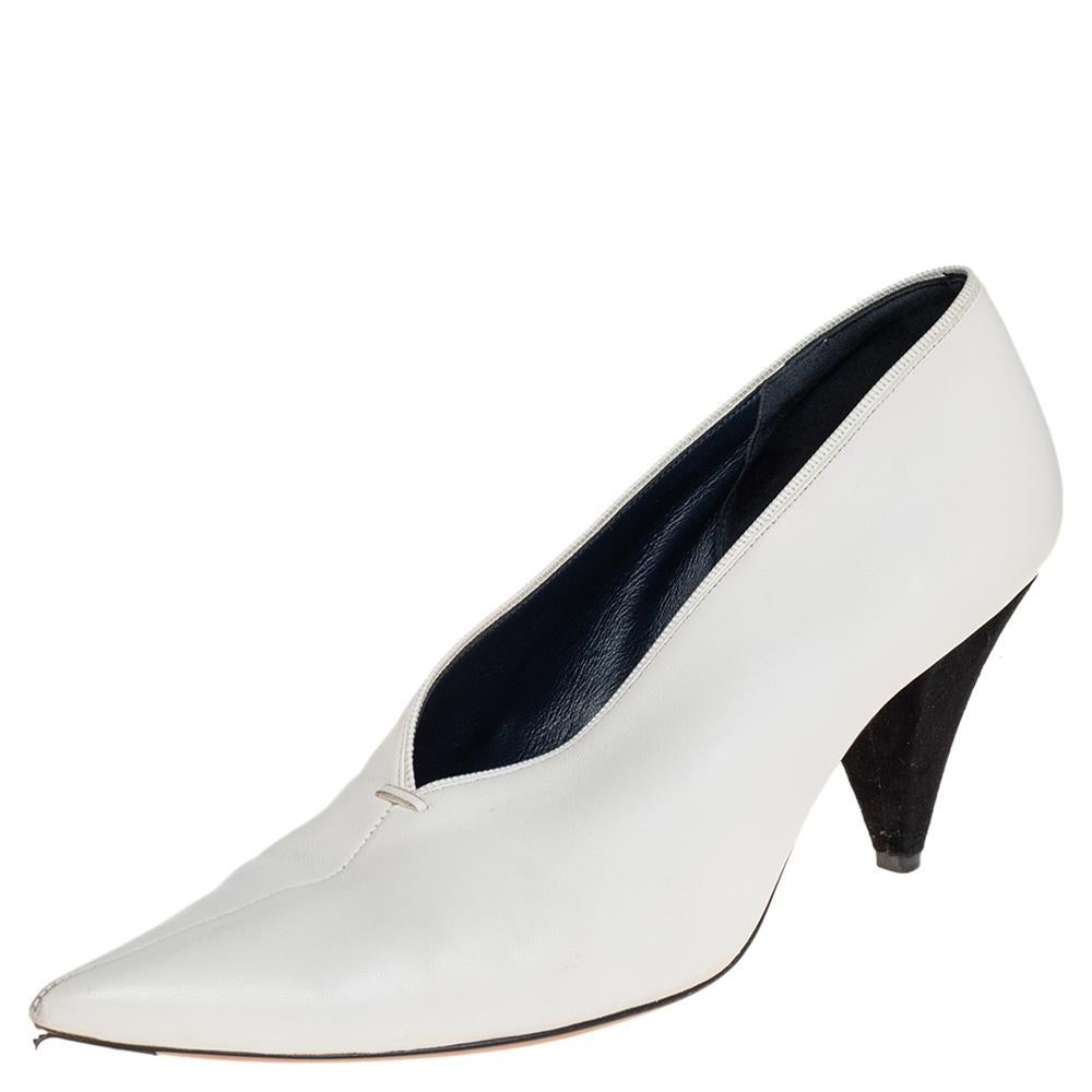 Simplicity and sophistication take center stage in these white pumps from Celine! They have been crafted from leather and feature a V-neck silhouette with pointed toes. They come equipped with comfortable leather-lined insoles and stand tall on 8 cm