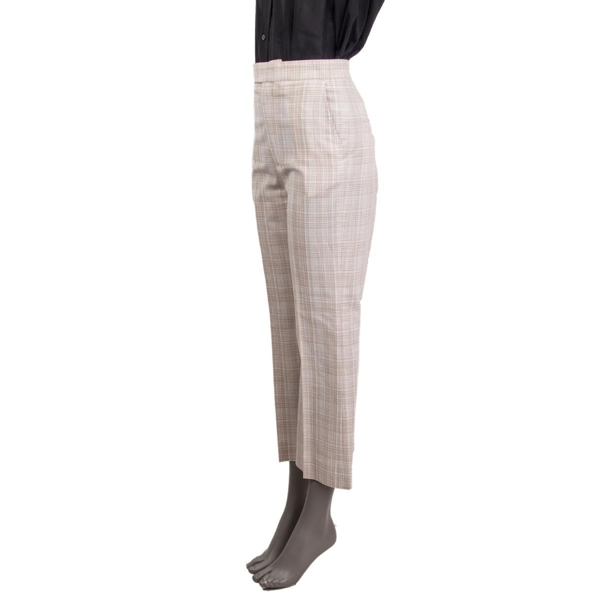 100% authentic Céline plaid tapered pants in off-white and light brown linen (55%), cotton (21%), viscose (21%) and polyamide (3%) with pockets. Close on the front with a zipper and hook fasteners. Partially lined in cotton (100%). Have been worn