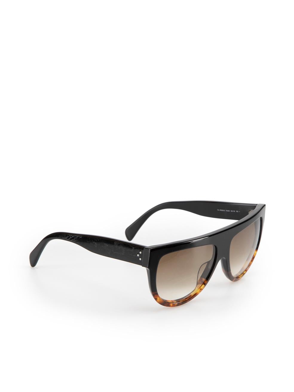CONDITION is Very good. Hardly any visible wear to sunglasses is evident on this used Celine designer resale item. These sunglasses come with original case.



Details


Black and brown

Acetate

Tortoiseshell pattern

Brown fade lenses



 

Made