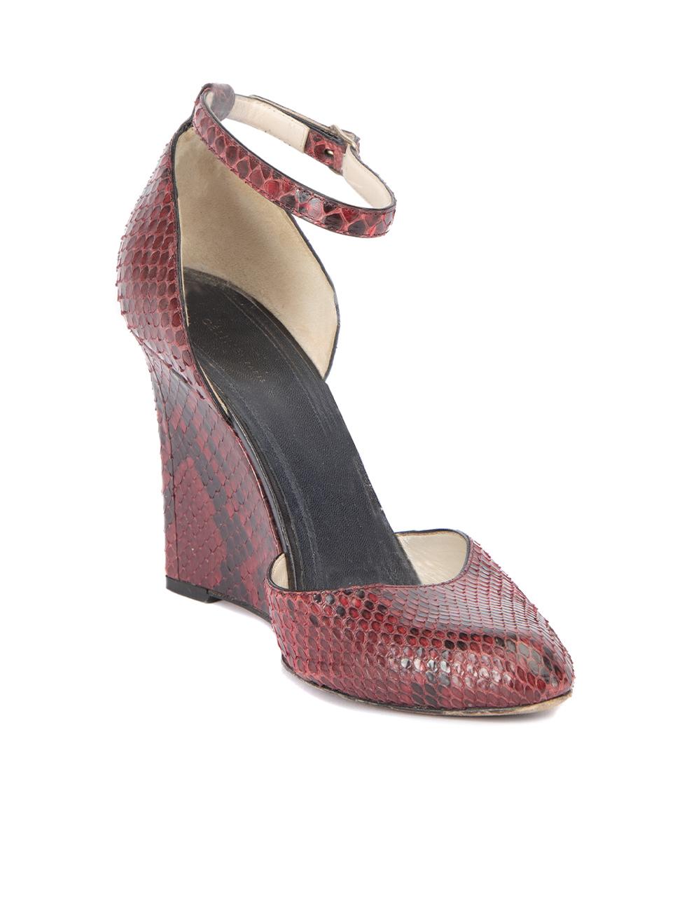 CONDITION is Very good. Minimal wear to wedges is evident. Minimal wear to the snakeskin exterior which is peeling a tiny bit on the right pair of this used Céline designer resale item. This item comes with original dustbag.  Details  Burgundy