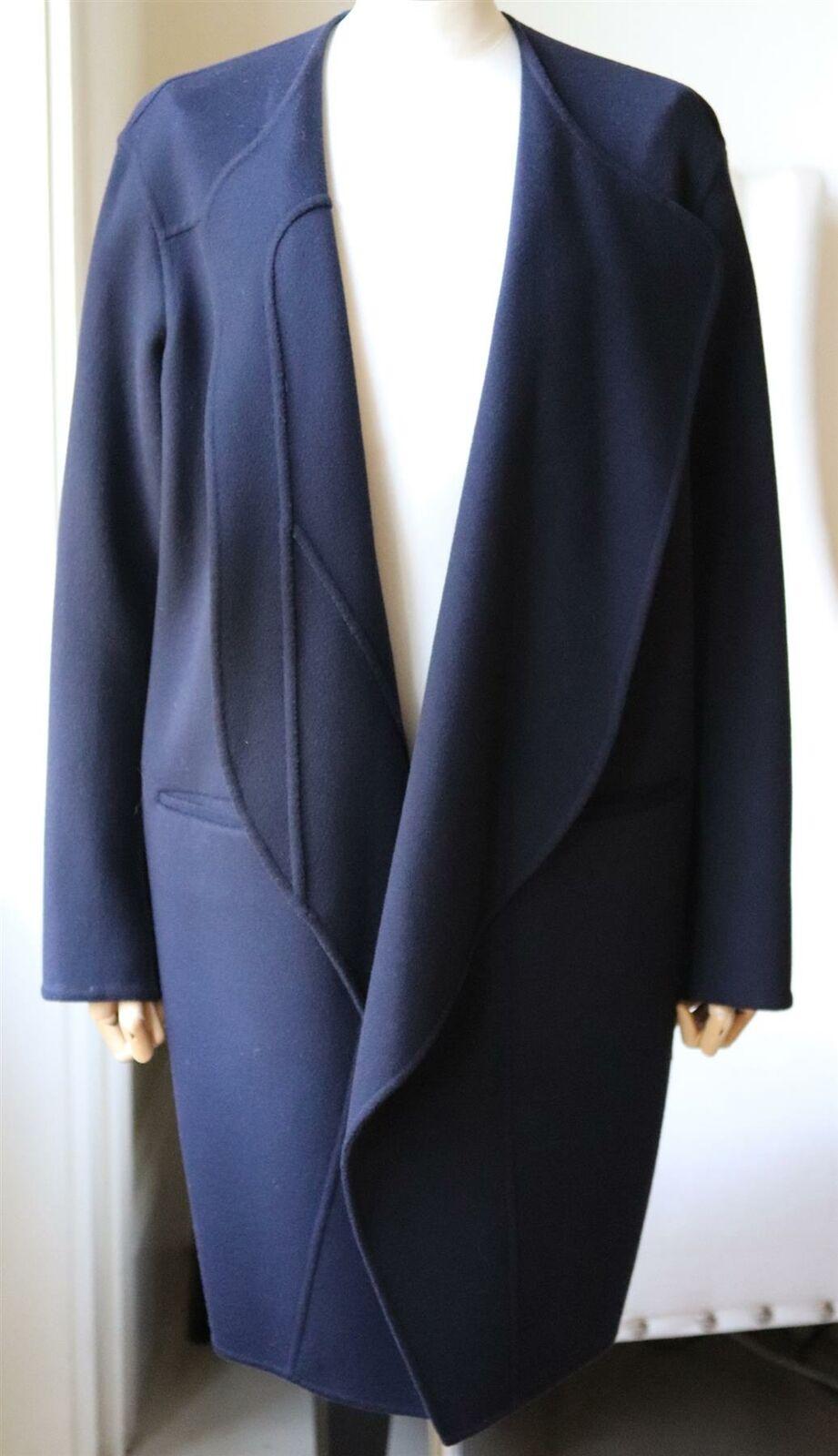 This Céline by Phoebe Philo coat has been made from wool with hints of soft cashmere, the oversized silhouette has large lapels and pockets.
Navy wool and cashmere-blend. 
Slips on.
90% Wool, 10% cashmere; lining: 100% cupro.
Size: FR 40 (UK 12, US