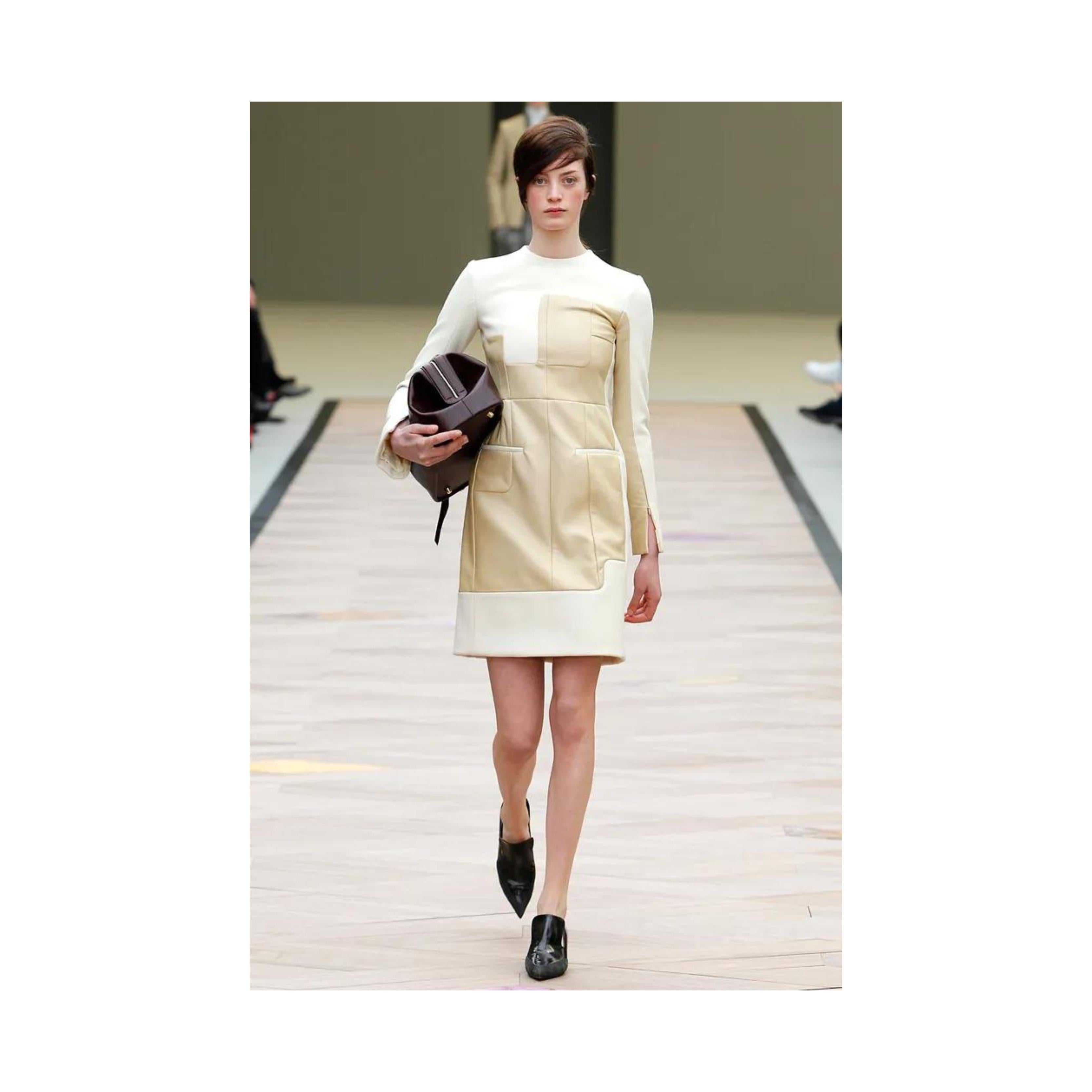 Introducing the Celine dress by Phoebe Philo, crafted from a mix of wool and leather for maximum texture contrast. As seen on the Fall 2011 Runway Collection dress in a different shade, this dress features a brown woven wool shift dress, completed