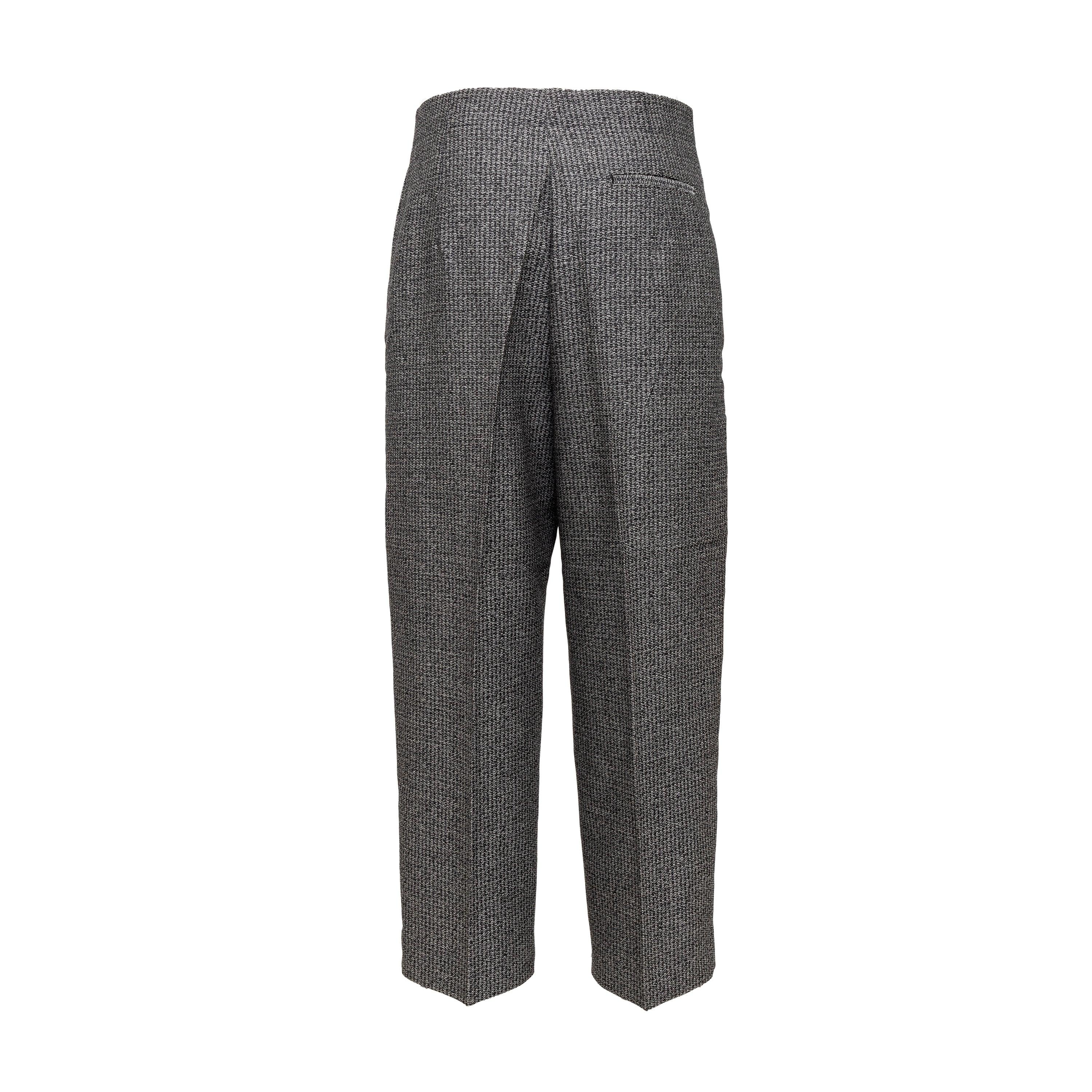Update your work wardrobe with this must-have trouser pants from Phoebe Philo's era. Crafted from high-quality wool with a black and white melange design, these straight fit pants feature standard fit with a zip opening and convenient pockets. The