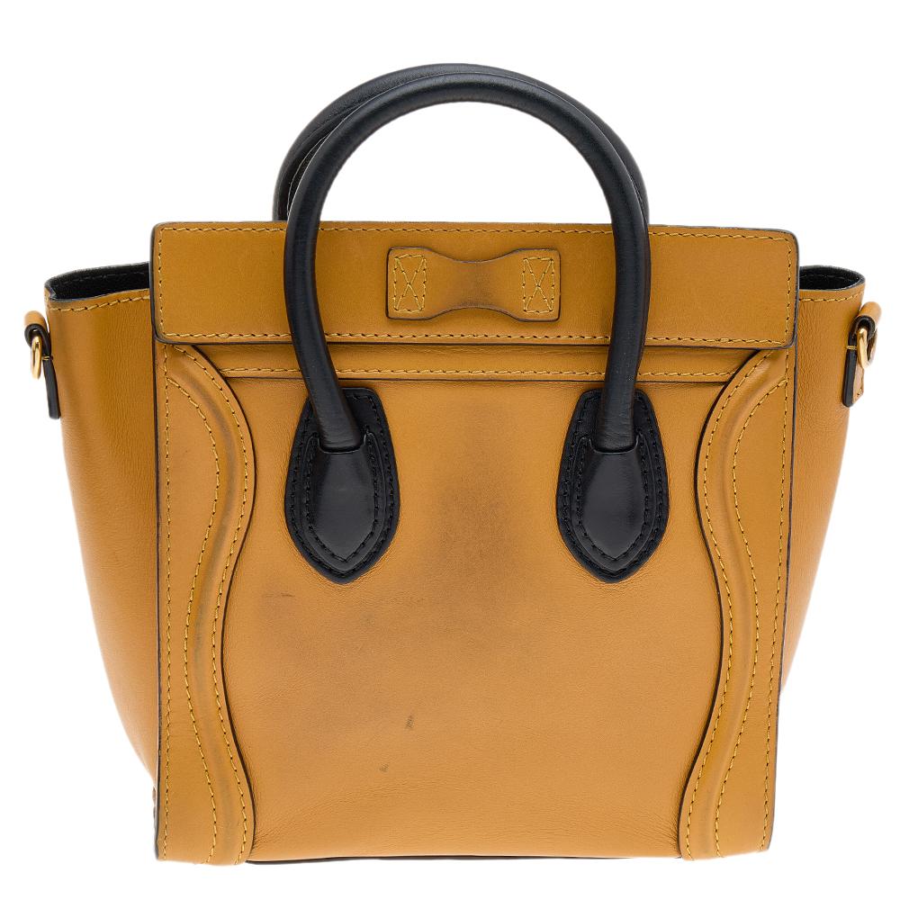 The Nano Luggage tote from Celine is one of the most popular handbags in the world. This tote is crafted from leather and designed in dual shades. It comes with rolled top handles, a detachable shoulder strap, and a front zip pocket. The bag is