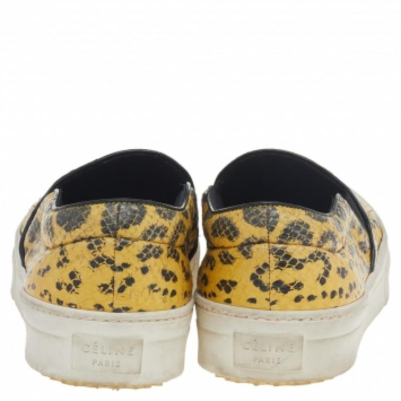 Made from snakeskin, these yellow & black sneakers come with a thick white rubber sole which is textured to provide optimum comfort and grip. The elasticated sides ensure this Céline pair is easy to slip on and off. Pull off the street-chic look by