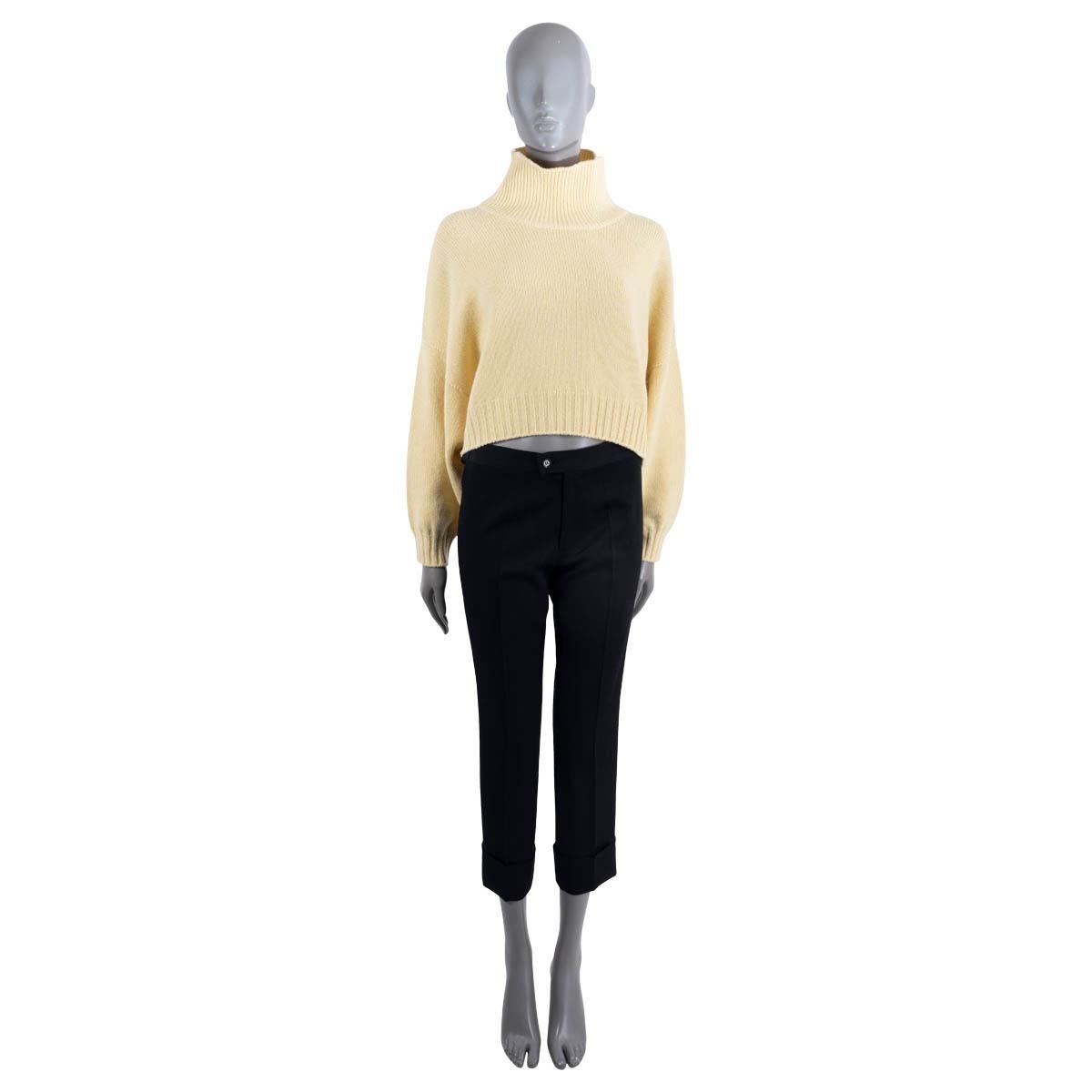 100% authentic Celine cropped high-neck sweater in yellow cashmere (100%). Features small embroidered Triomphe logo on the front. Unlined.  Has been worn and is in excellent condition.

Measurements
Model	2A11Z384D
Tag Size	XS
Size	XS
Shoulder