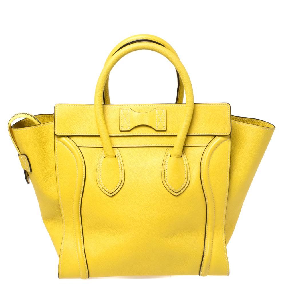 The Mini Luggage tote from Celine is one of the most popular handbags in the world. This tote is crafted from leather and comes with rolled top handles and a front zip pocket. The bag is equipped with a well-sized Alcantara interior for you to carry