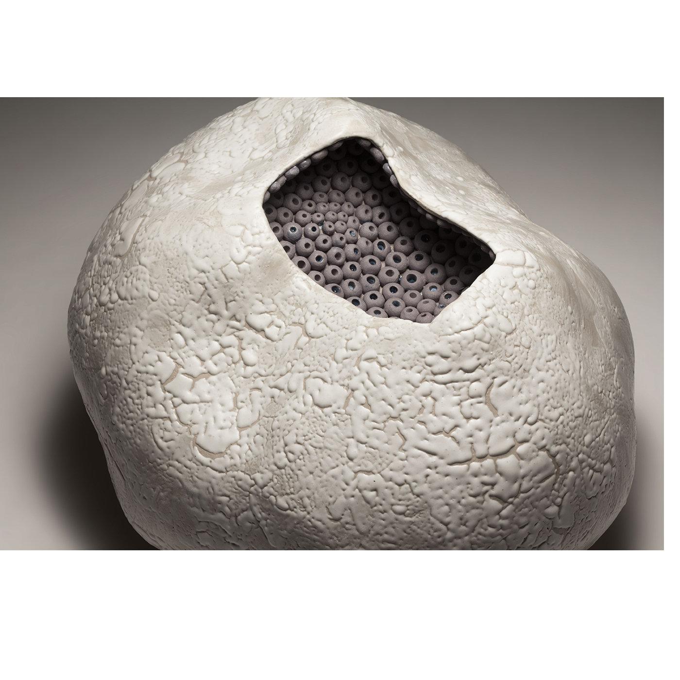 A creative exploration of textures and organic shapes characterizes Angelica Tulimiero’s unmistakable style. This intricate, organically shaped ceramic sculpture is modeled exclusively by hand using the ancient colombino technique (known as cooking)