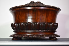 A very fine Regency flame mahogany cellarette.