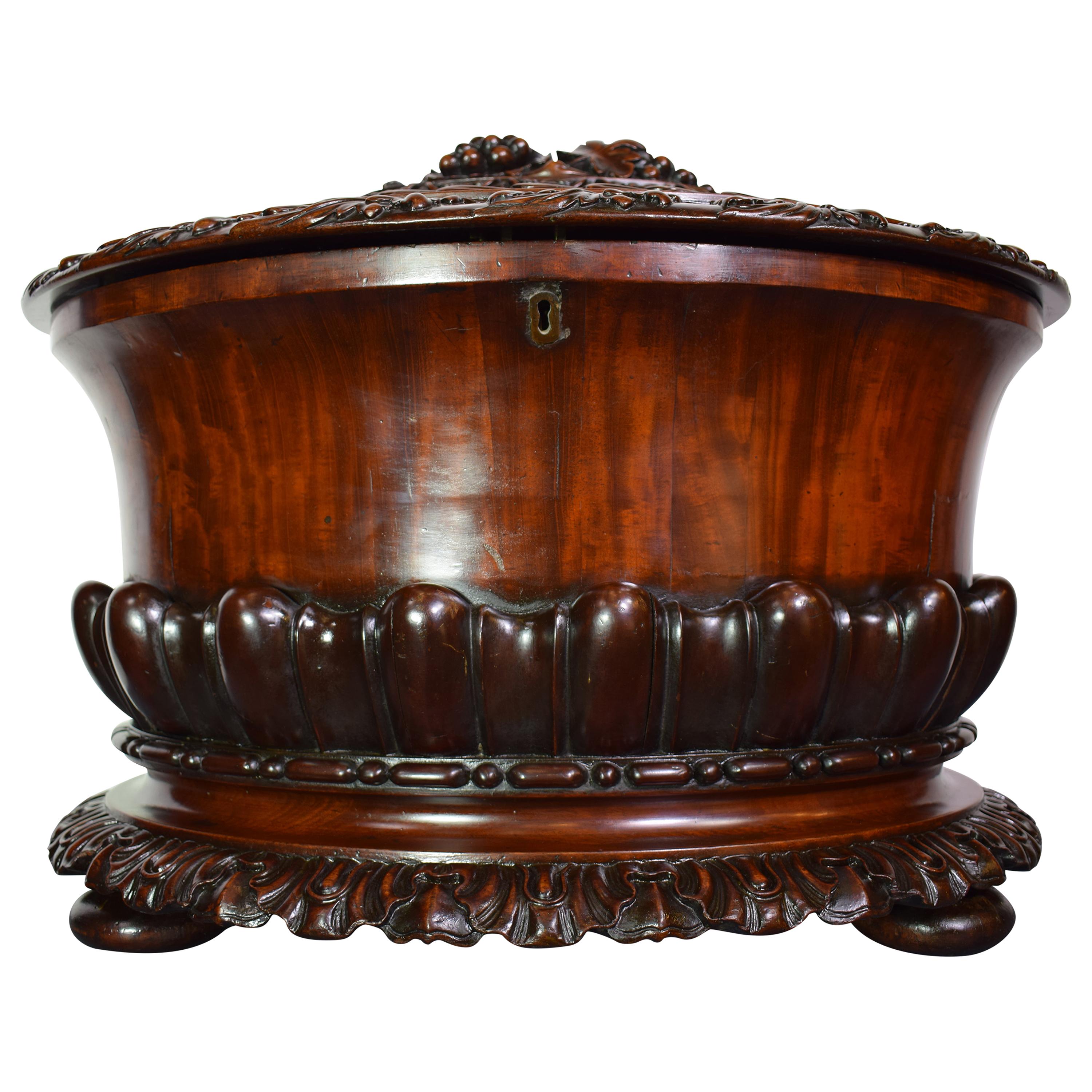 A very fine Regency flame mahogany cellarette.