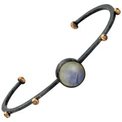 Brazalete Celles de plata y oro de 8 quilates con piedra de luna y diamante champán