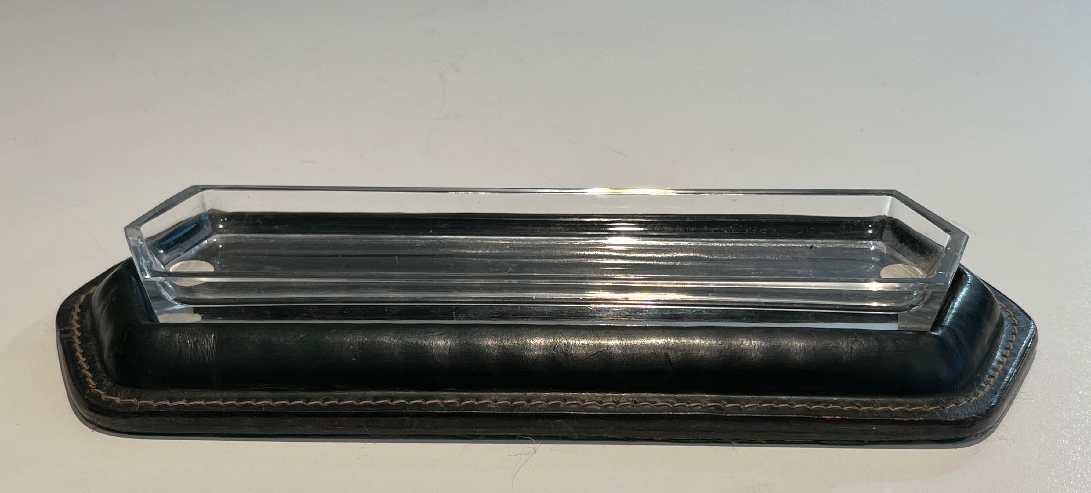 This nice pen holder is made of cellier stitched leather and glass. This is a French work in the Style of Jacques Adnet. Circa 1950