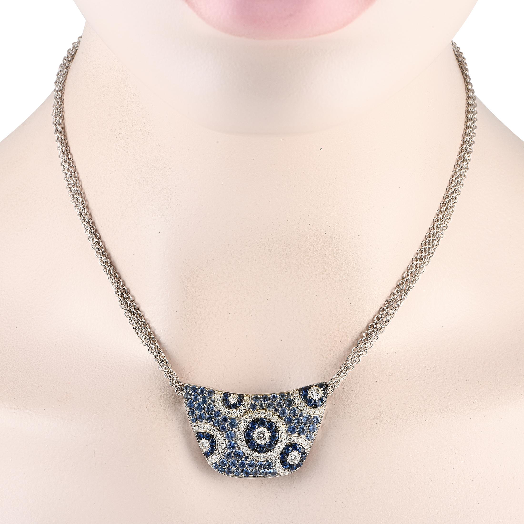 Diamonds totaling 1.32 carats and blue sapphires with a total weight of 3.90 carats come together in an artistic arrangement on this exquisite Celine necklace. Crafted from 18K white gold, the pendant measures 1.0 long by 1.5 wide and sits at the